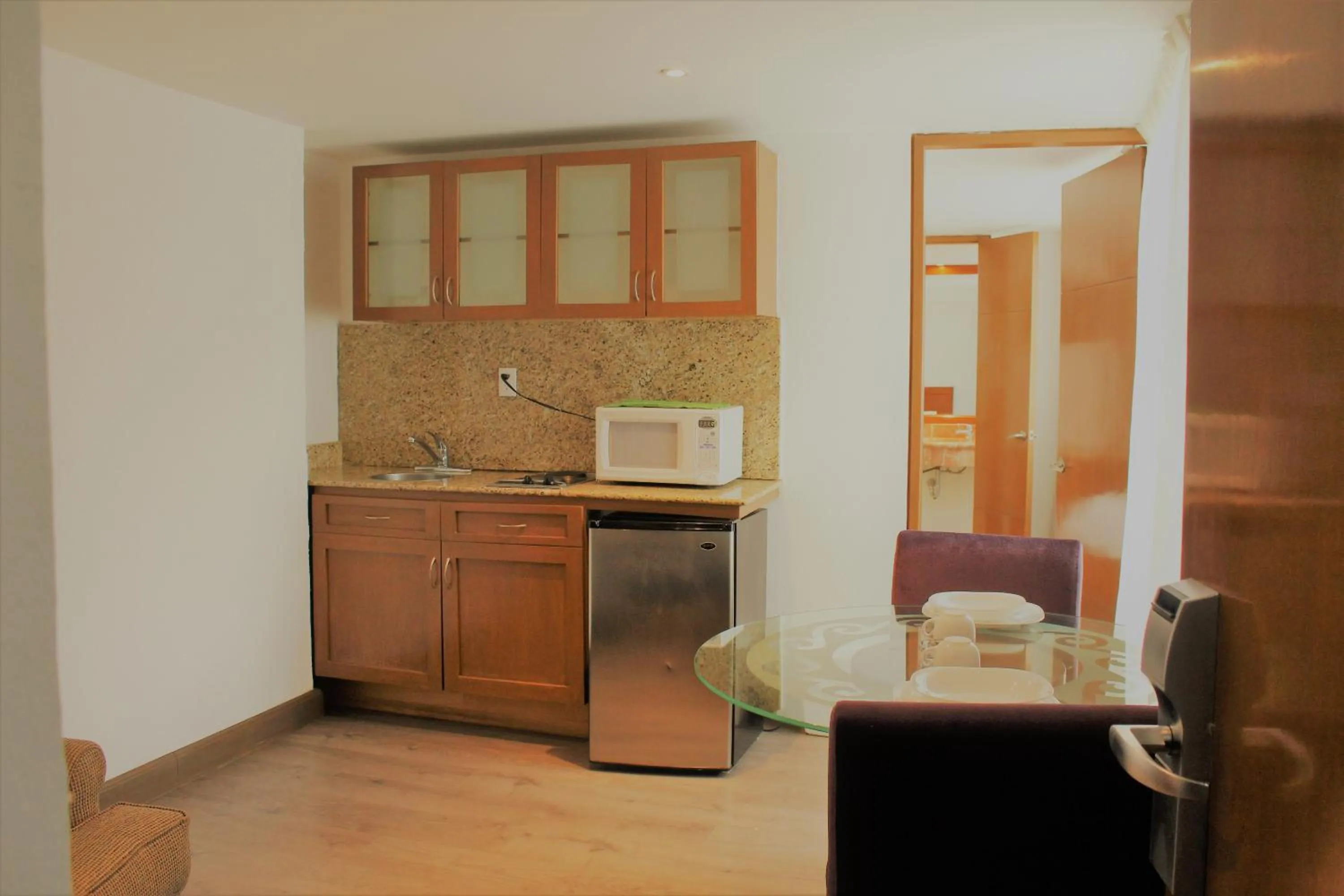 Kitchen or kitchenette in Condesa Suites