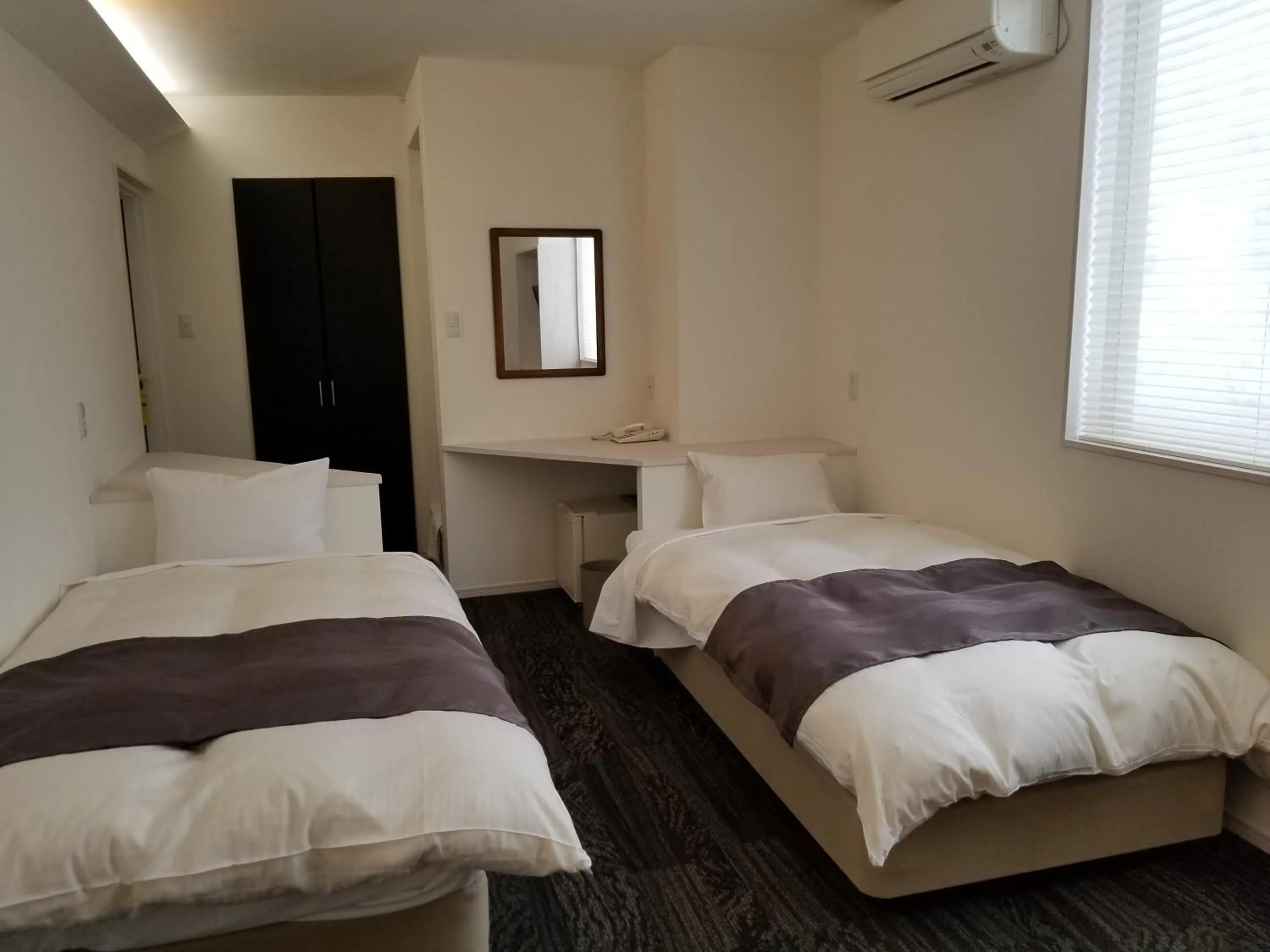 Bed in Hakuba Hotel Hana-no-Sato