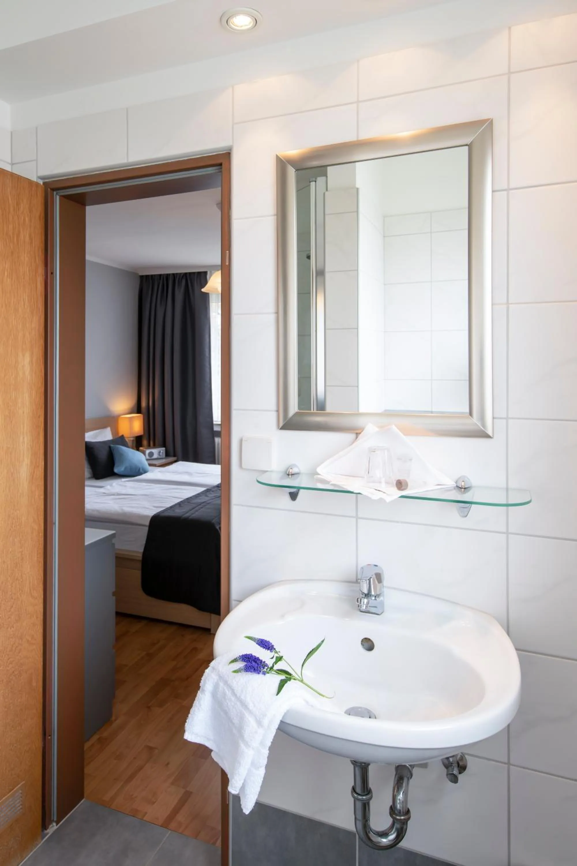 Bathroom, Bed in Hotel Birkenstern
