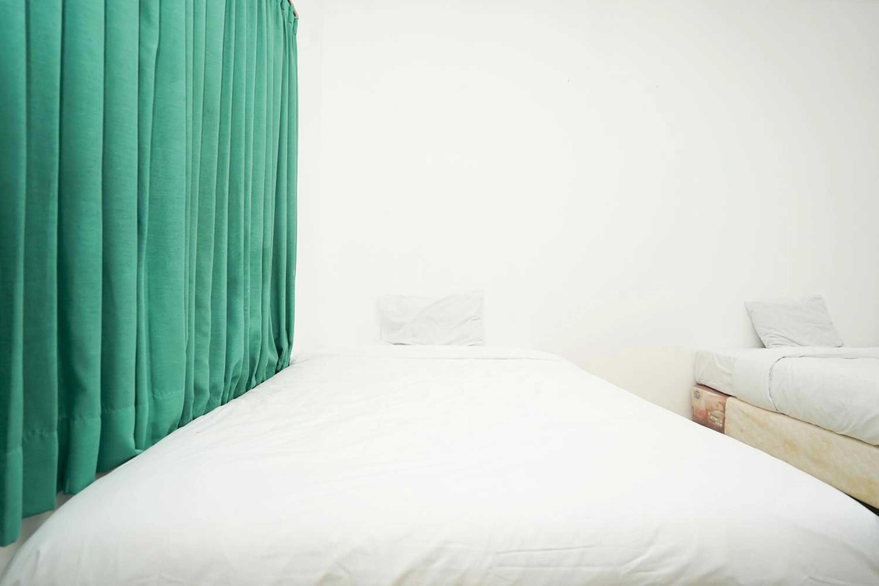 Bedroom, Bed in Merapi Inn Syariah by ecommerceloka