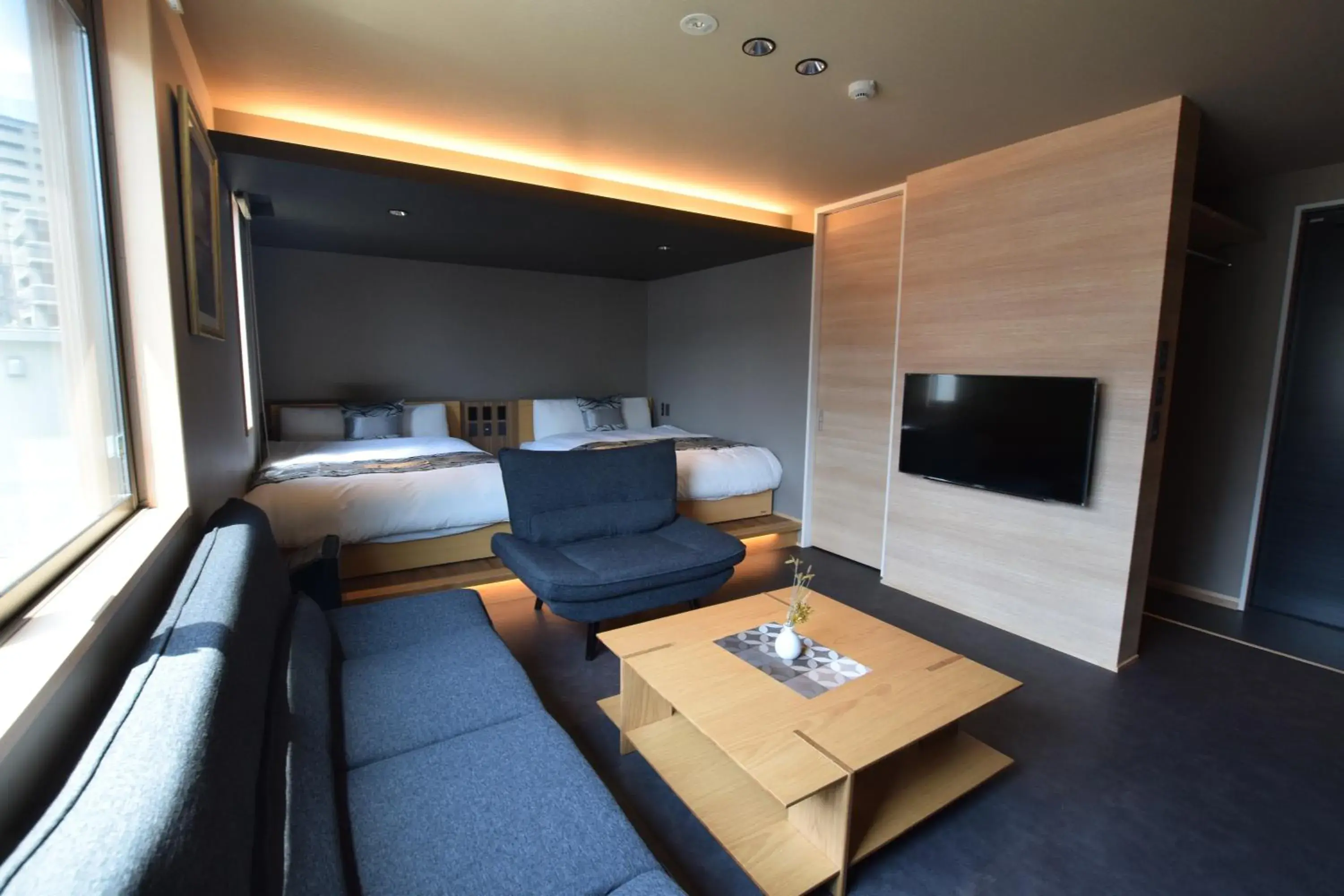 Photo of the whole room, Bed in GRAND BASE Beppu Ekimae Photo of the whole room, Bed in GRAND BASE Beppu Ekimae