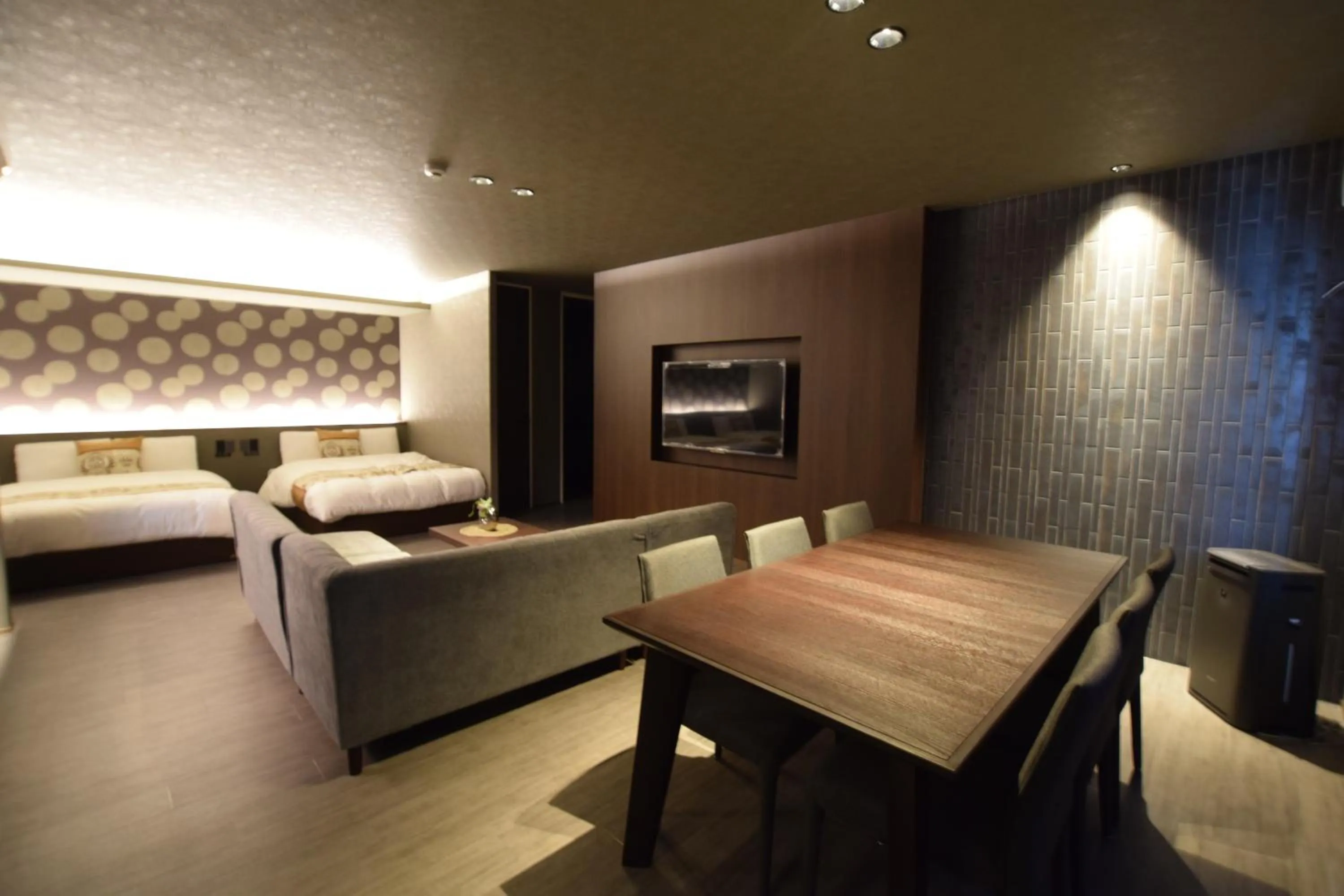 Photo of the whole room, Bed in GRAND BASE Beppu Ekimae