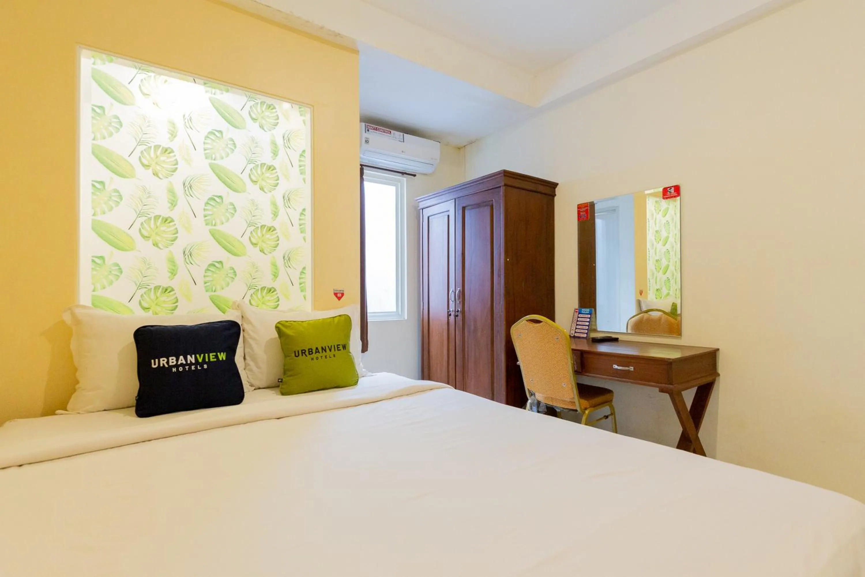 Bed in Urbanview Erga Family Residence Syariah Surabaya by RedDoorz