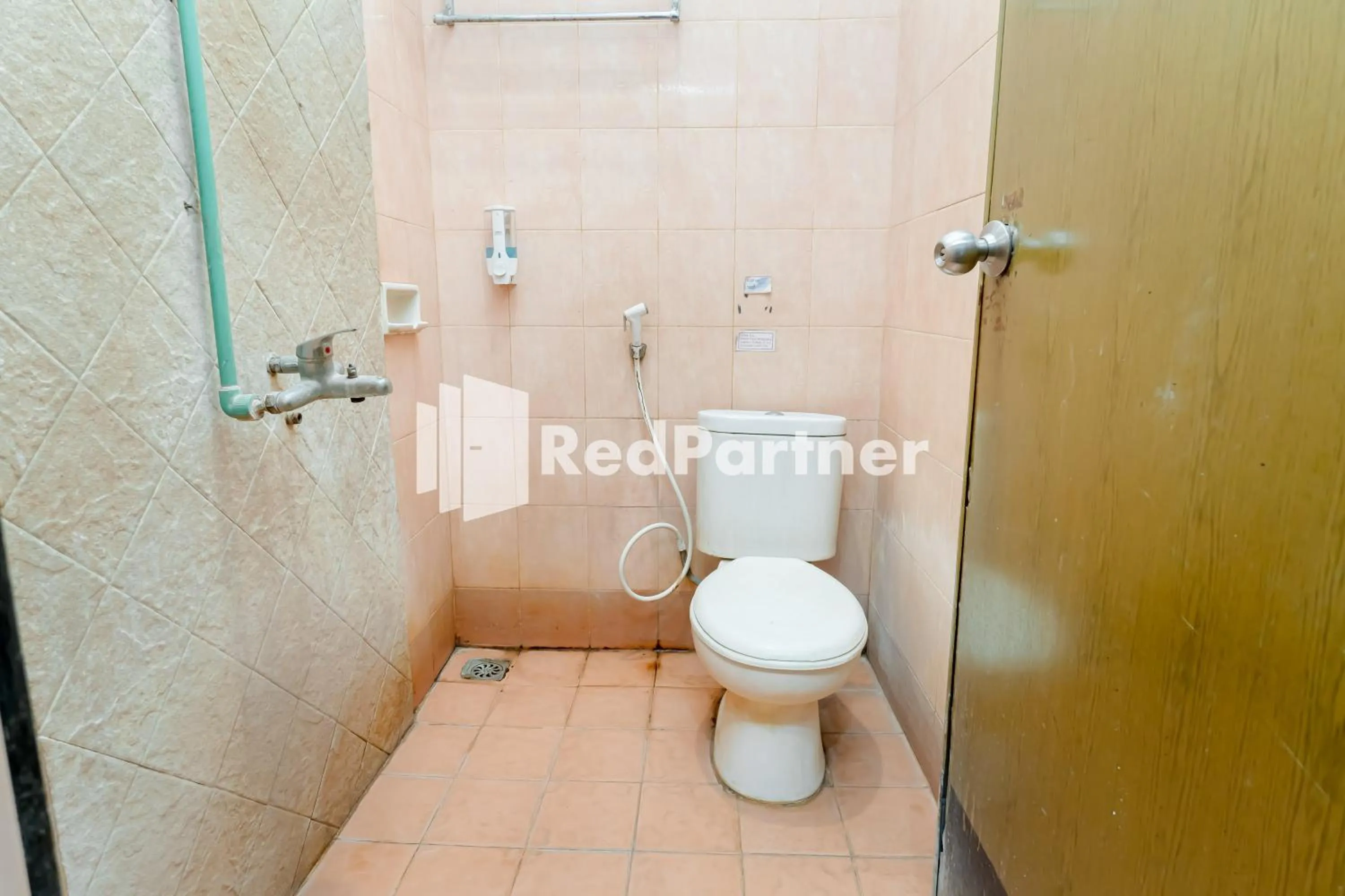 Bathroom in Cherry Pink Hotel Medan Mitra RedDoorz