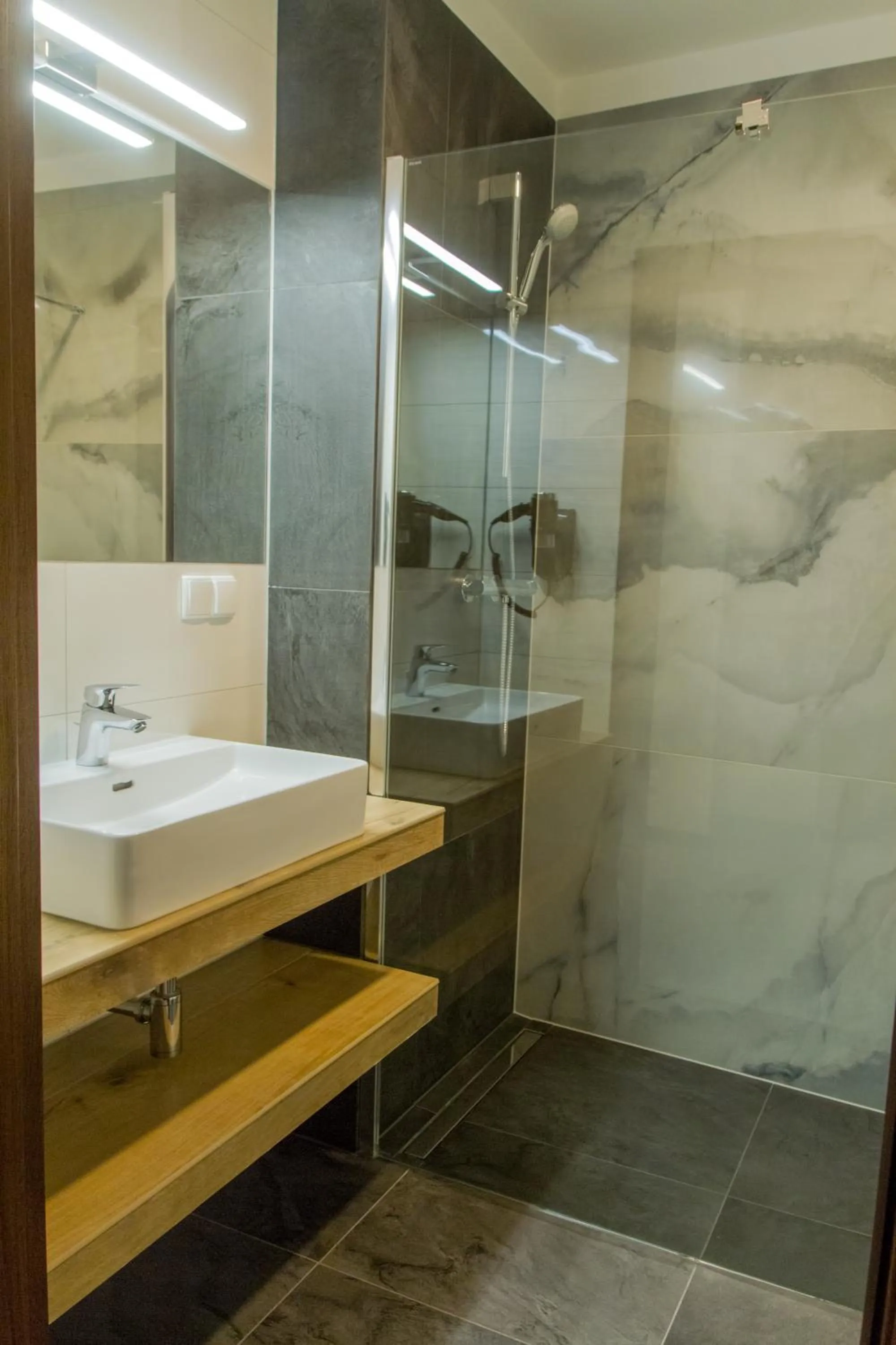 Shower in Brassel Aparthotel