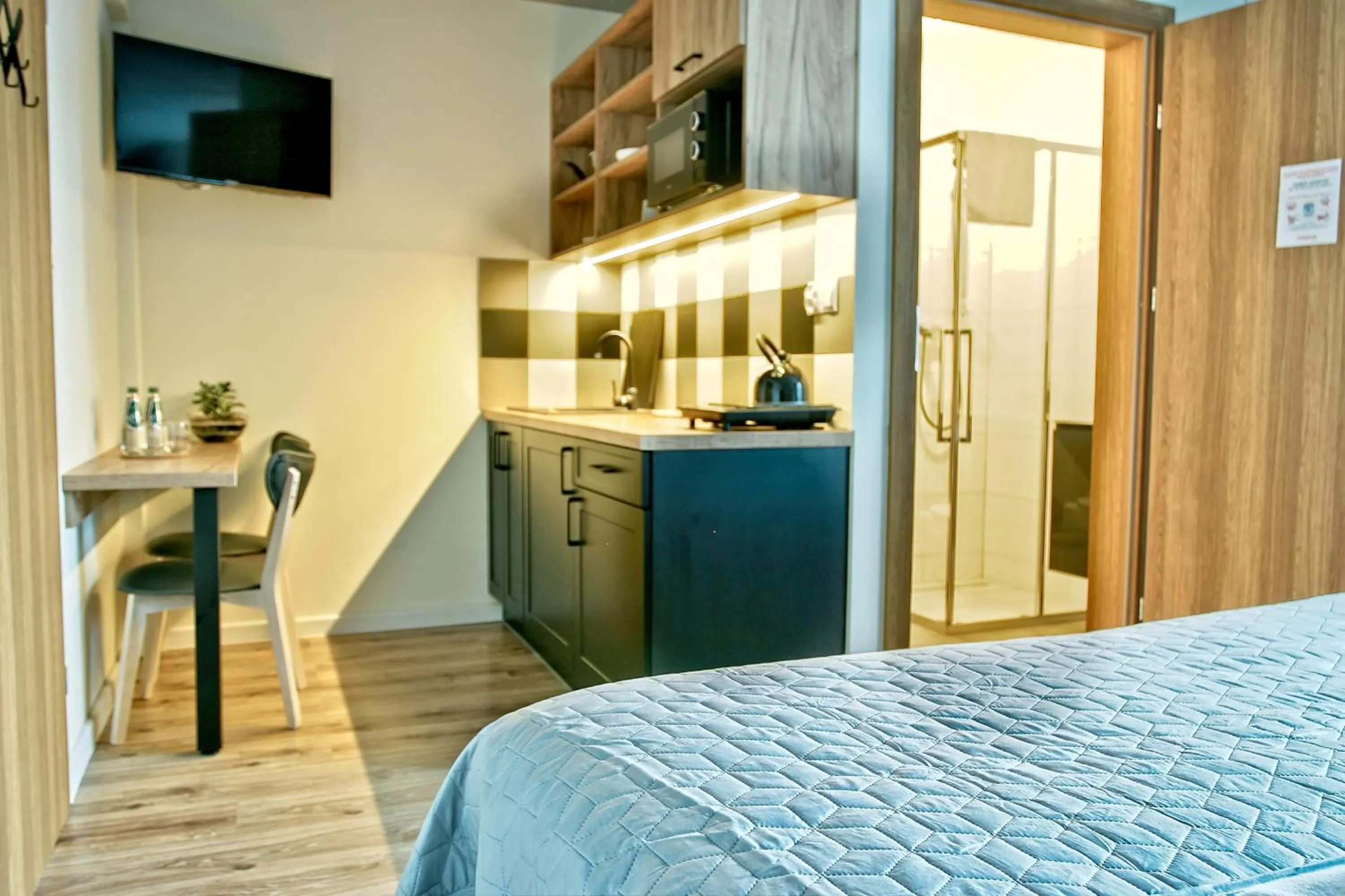 Kitchen or kitchenette, Bed in Apartamenty Magia Gór