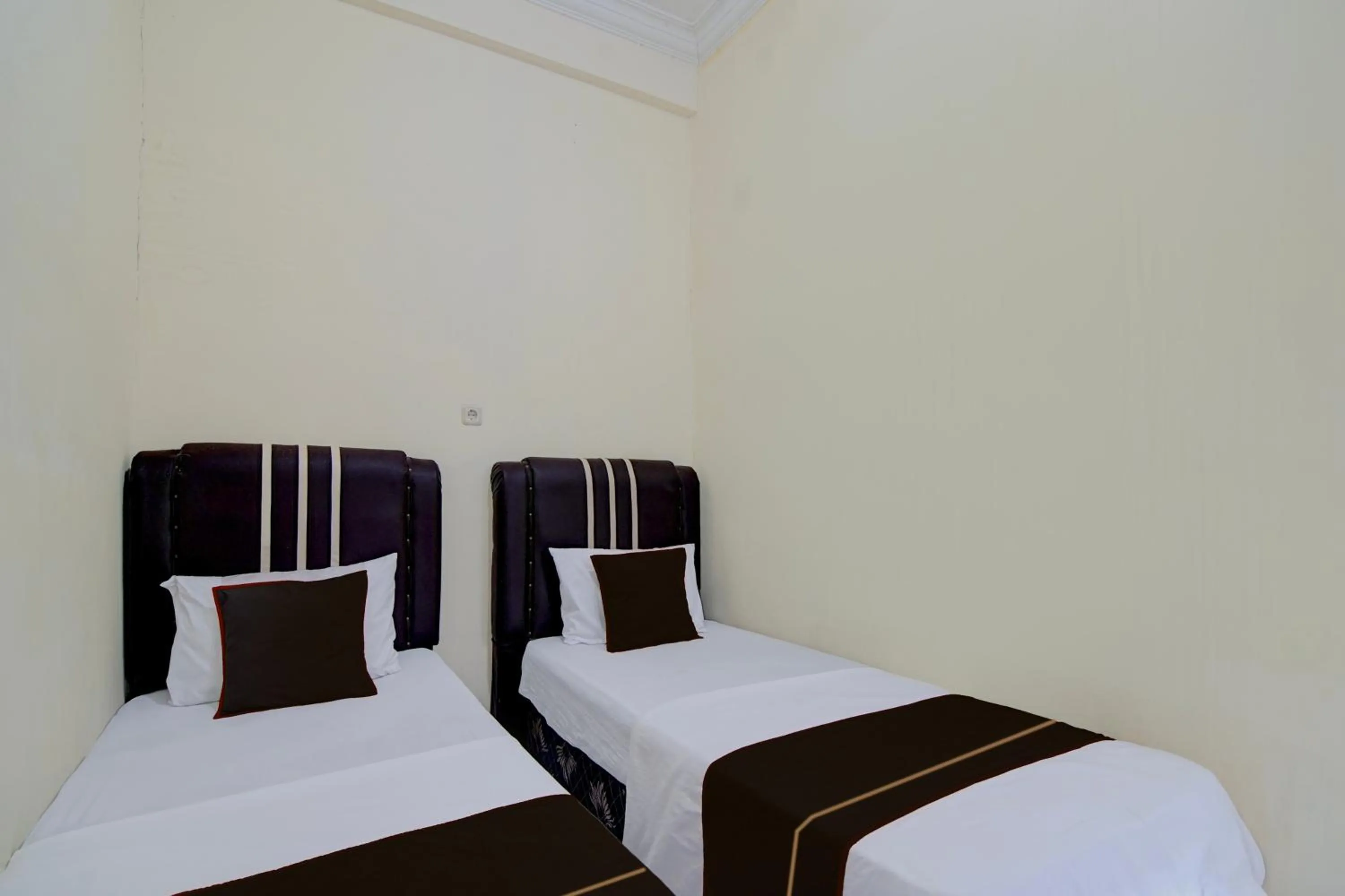 Bedroom, Bed in Hotel O Pekanbaru near Mall Ciputra Seraya formerly Lotus Inn