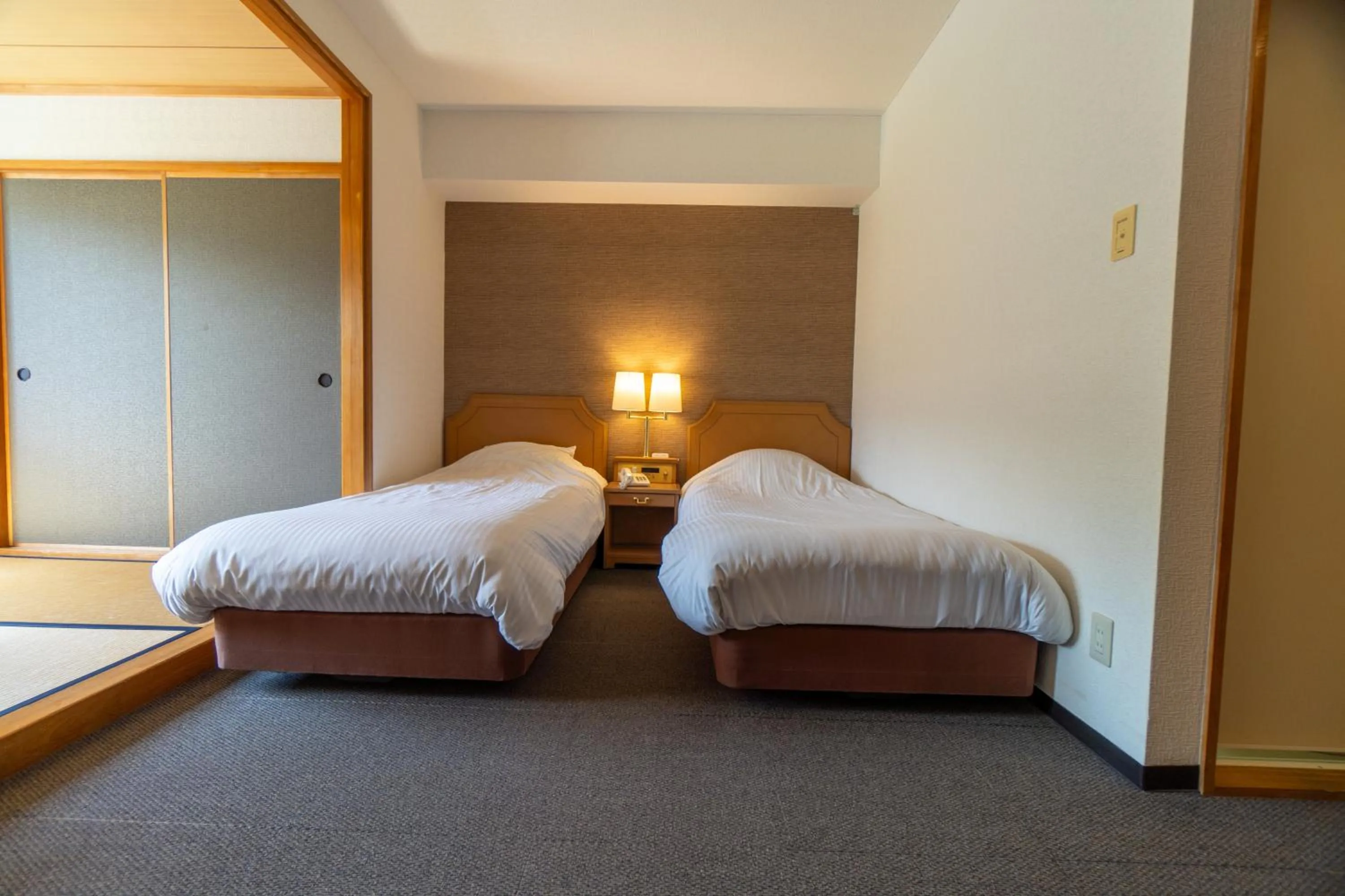 Bed in Hakuba Panorama Hotel