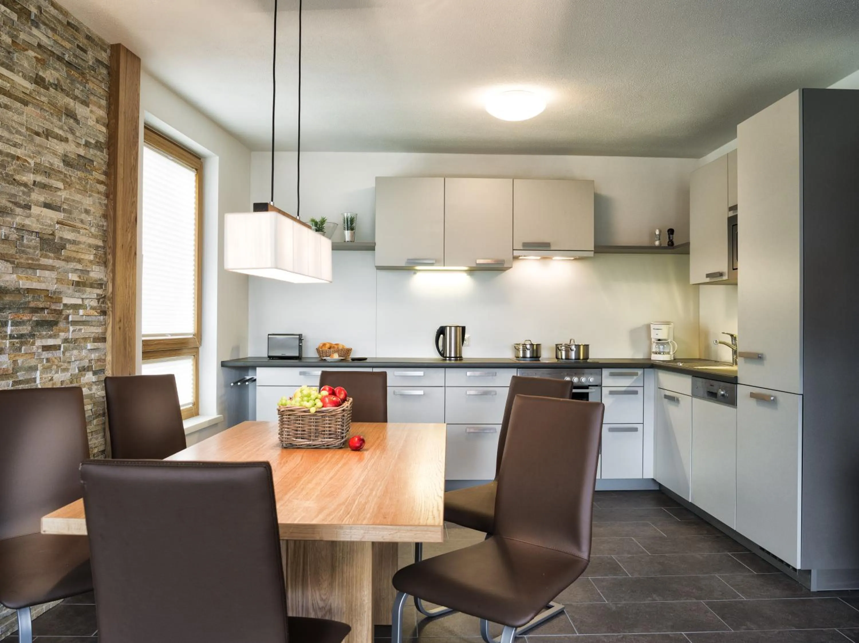 Kitchen or kitchenette in AlpenParks Residence Zell am See