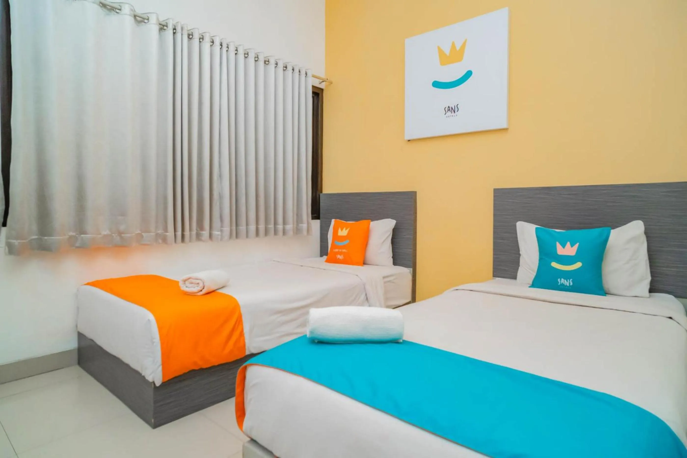 Bed in Sans Hotel Widarasari Cirebon