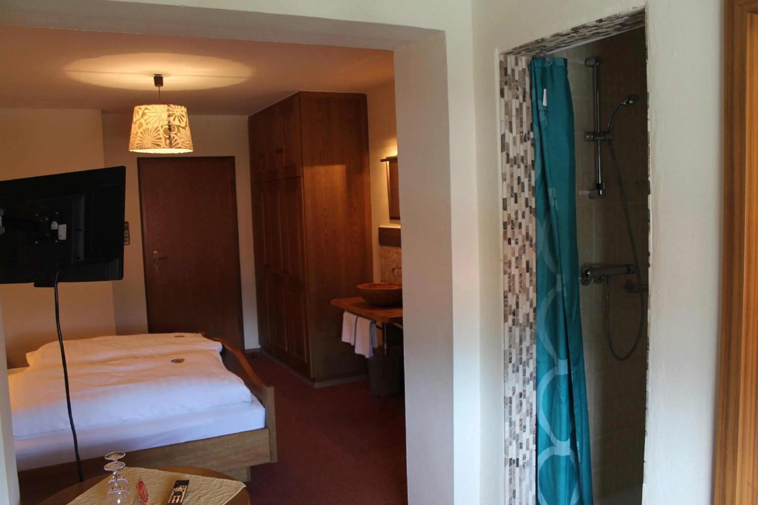 Photo of the whole room, Bed in DEVA Hotel-Restaurant Fischerwirt inklusive Chiemgau Card