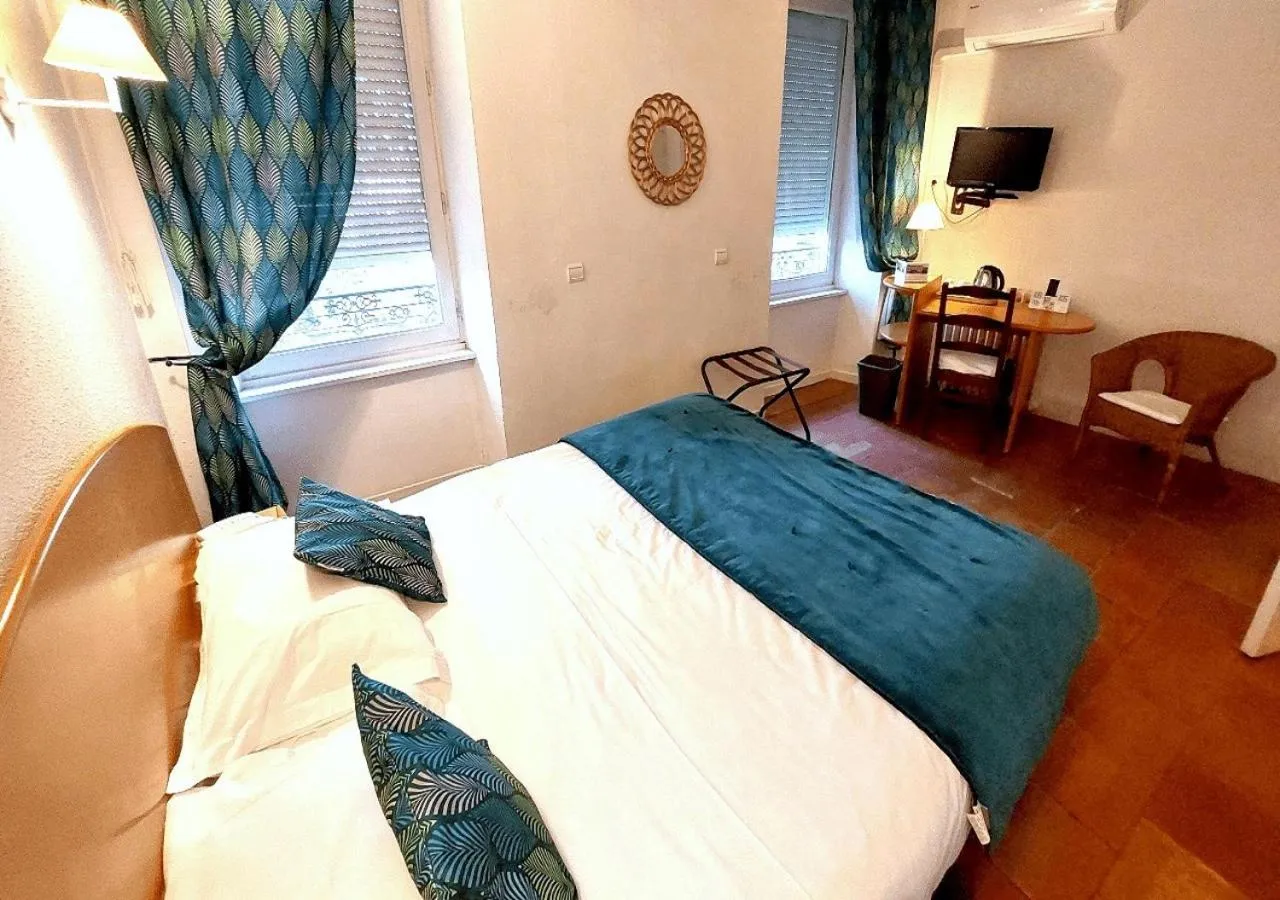 Bedroom, Bed in Logis Hôtels - Hôtel Restaurant du Midi