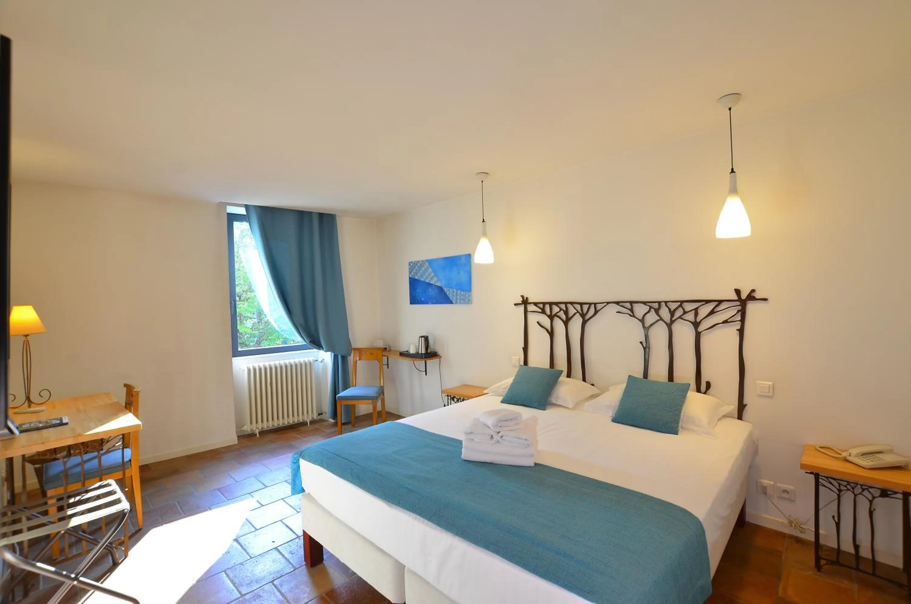 Bedroom, Bed in Logis Hôtels - Hôtel Restaurant du Midi