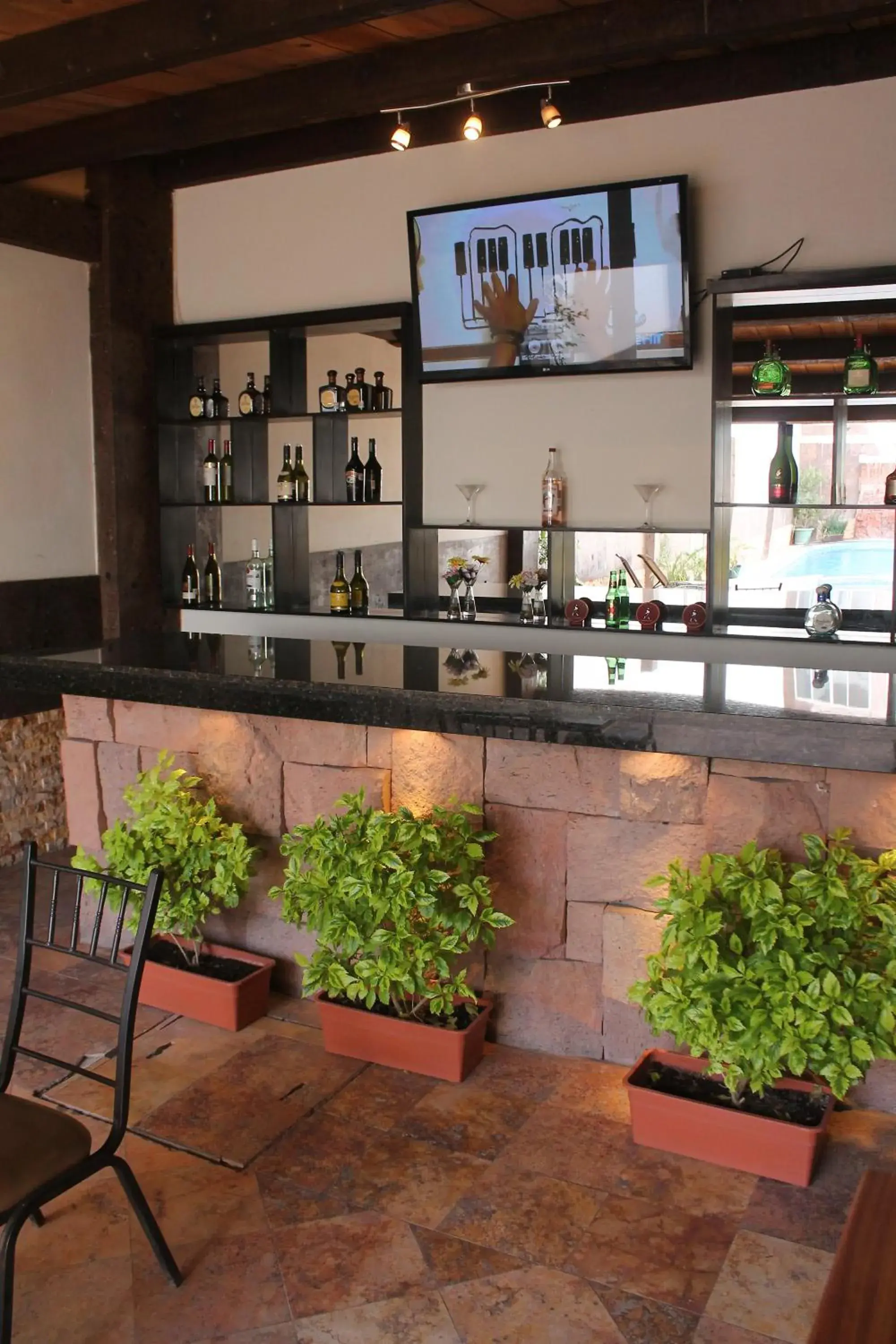 Lounge or bar in Hotel Rincon Real Suites Lounge or bar in Hotel Rincon Real Suites