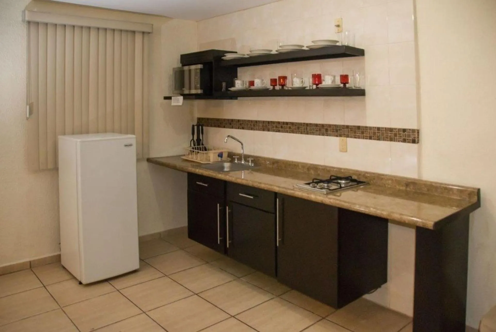 Kitchen or kitchenette in Hotel Rincon Real Suites