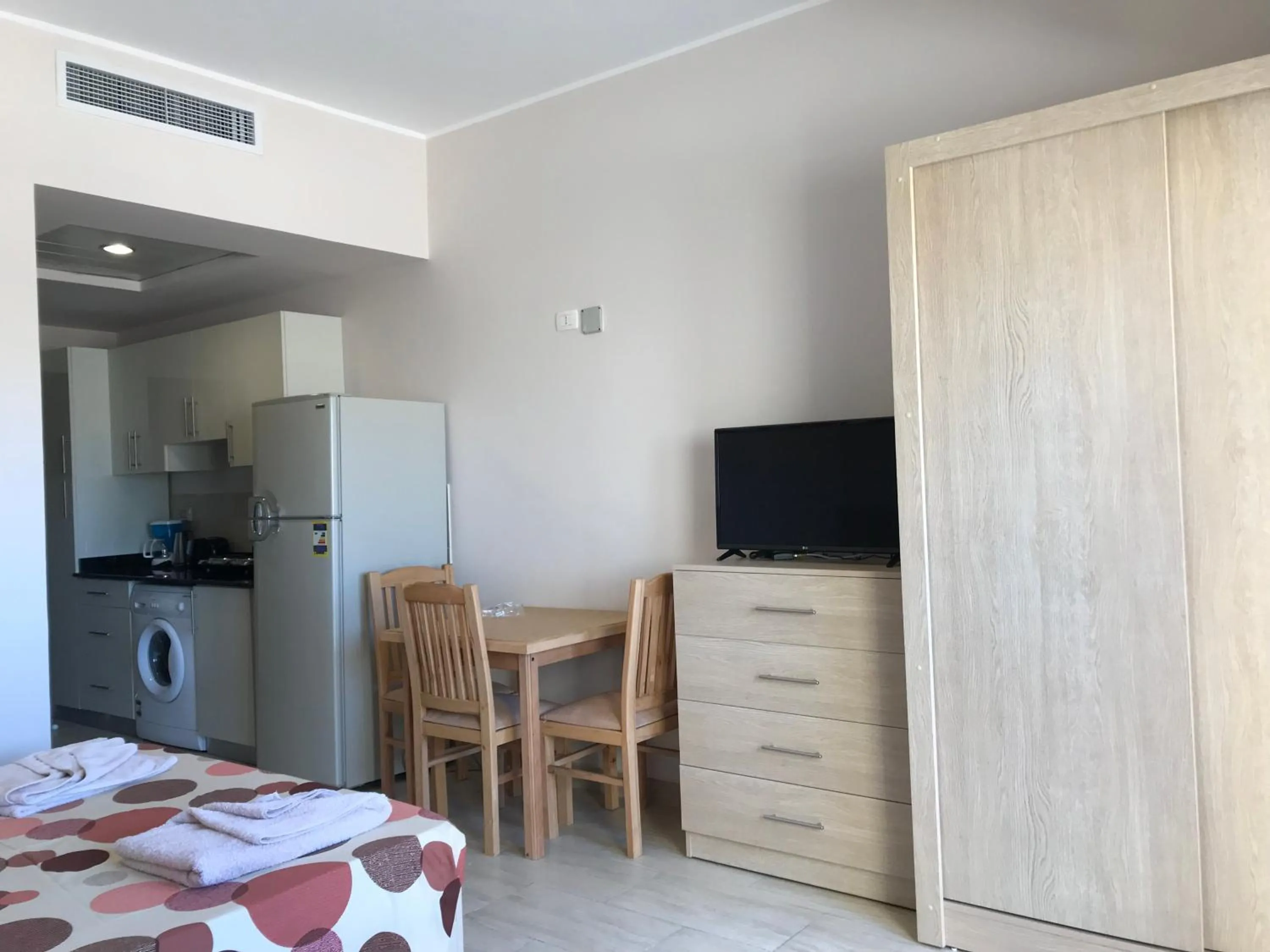 TV and multimedia, Bed in AlDau Heights Apartments