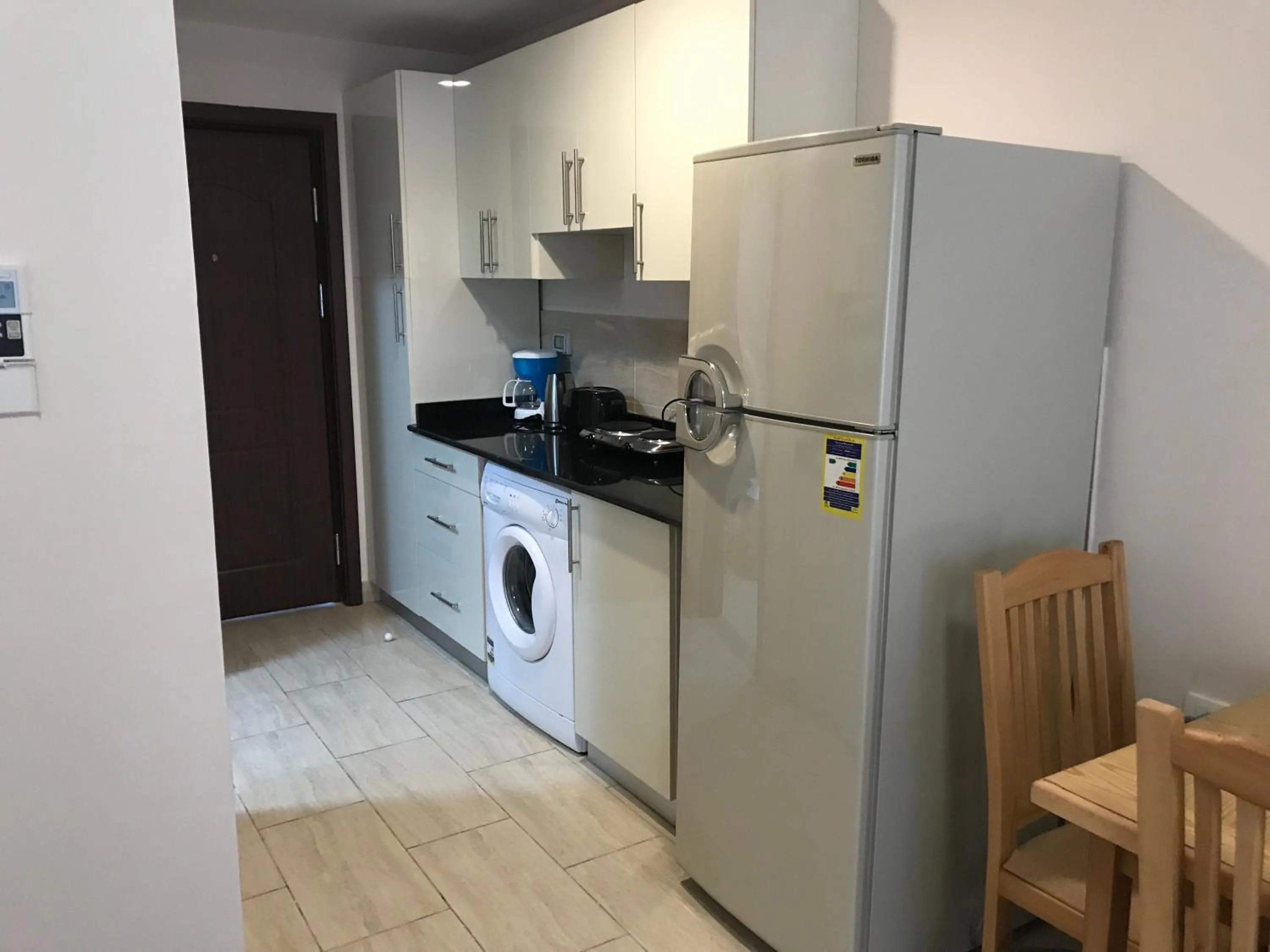 Communal kitchen in AlDau Heights Apartments