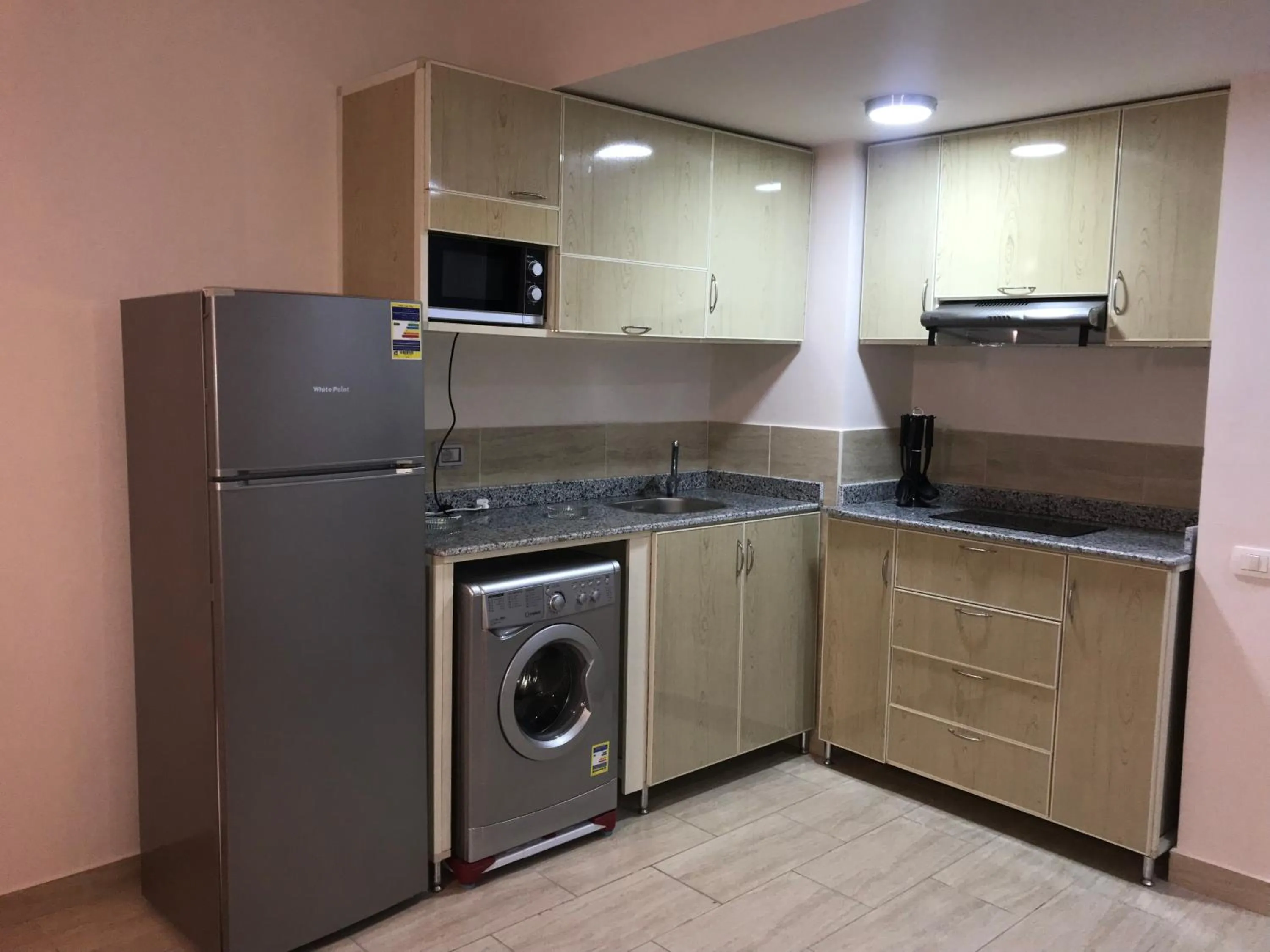 Communal kitchen in AlDau Heights Apartments