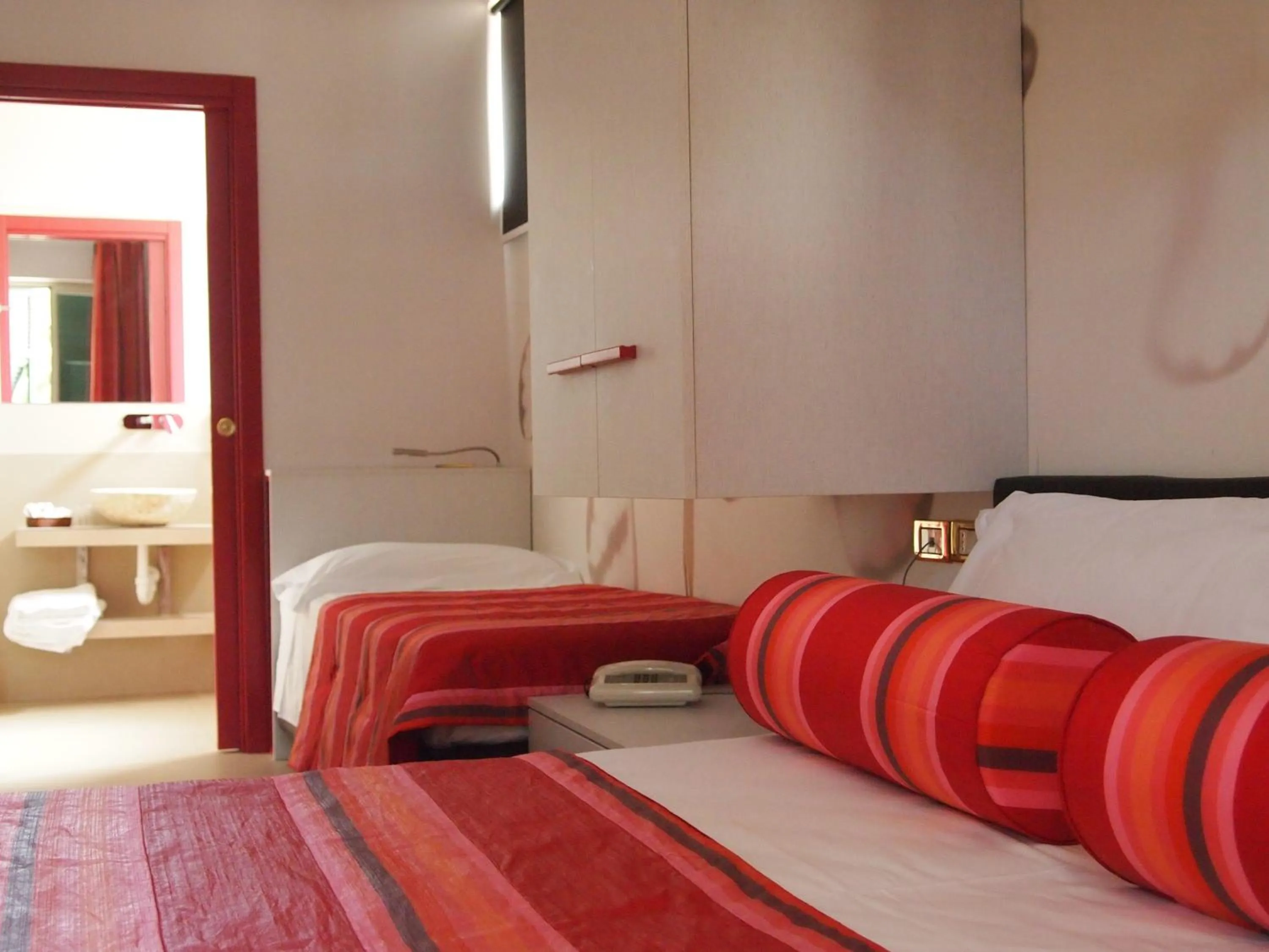 Bed in Piccolo Hotel