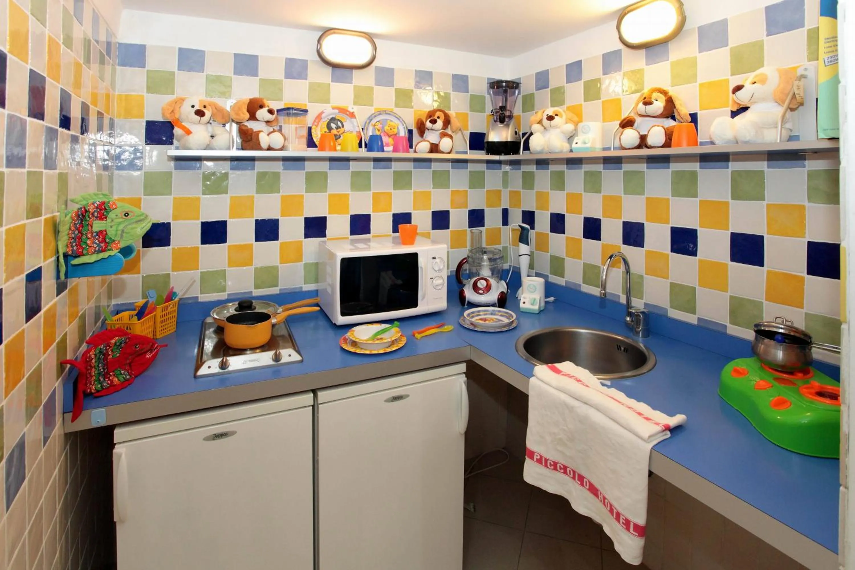 Kitchen or kitchenette in Piccolo Hotel