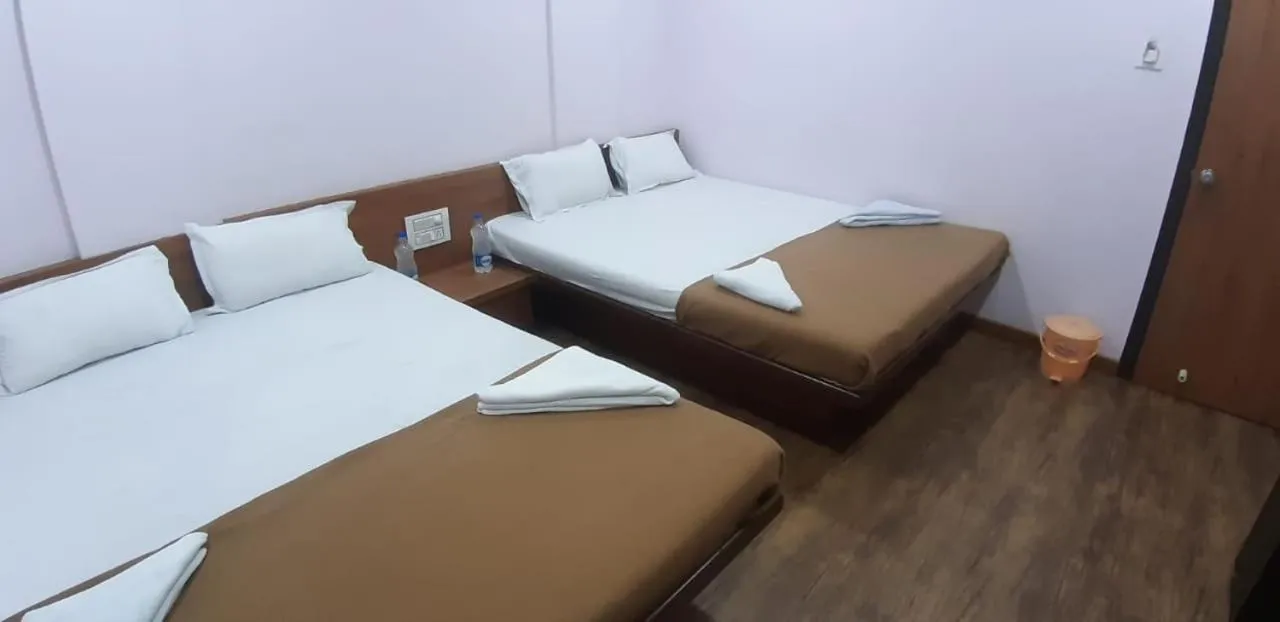 Bed in Rajhuns Deluxe Lodging