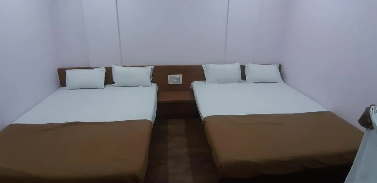 Bed in Rajhuns Deluxe Lodging