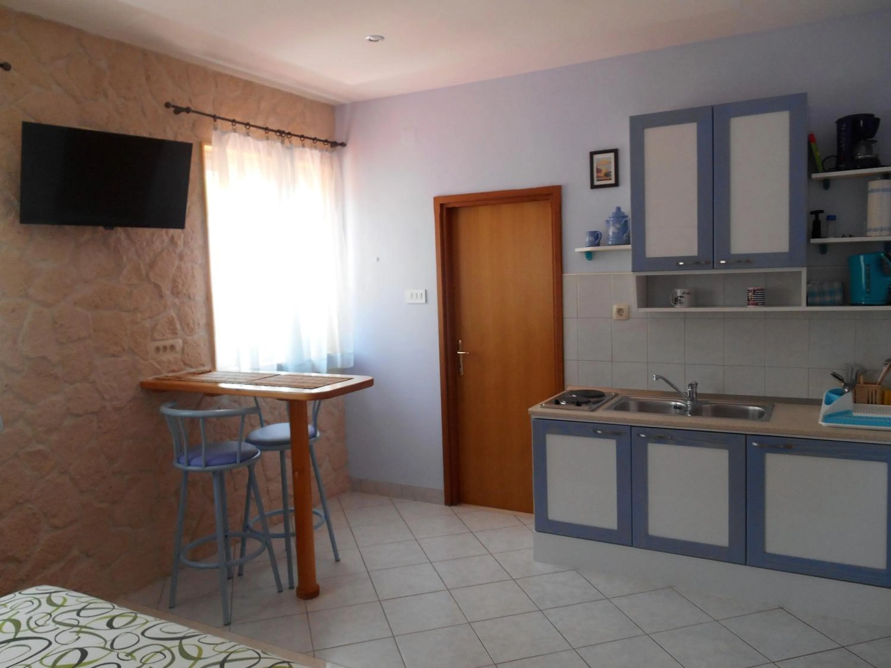 Kitchen or kitchenette in Apartments Brešan