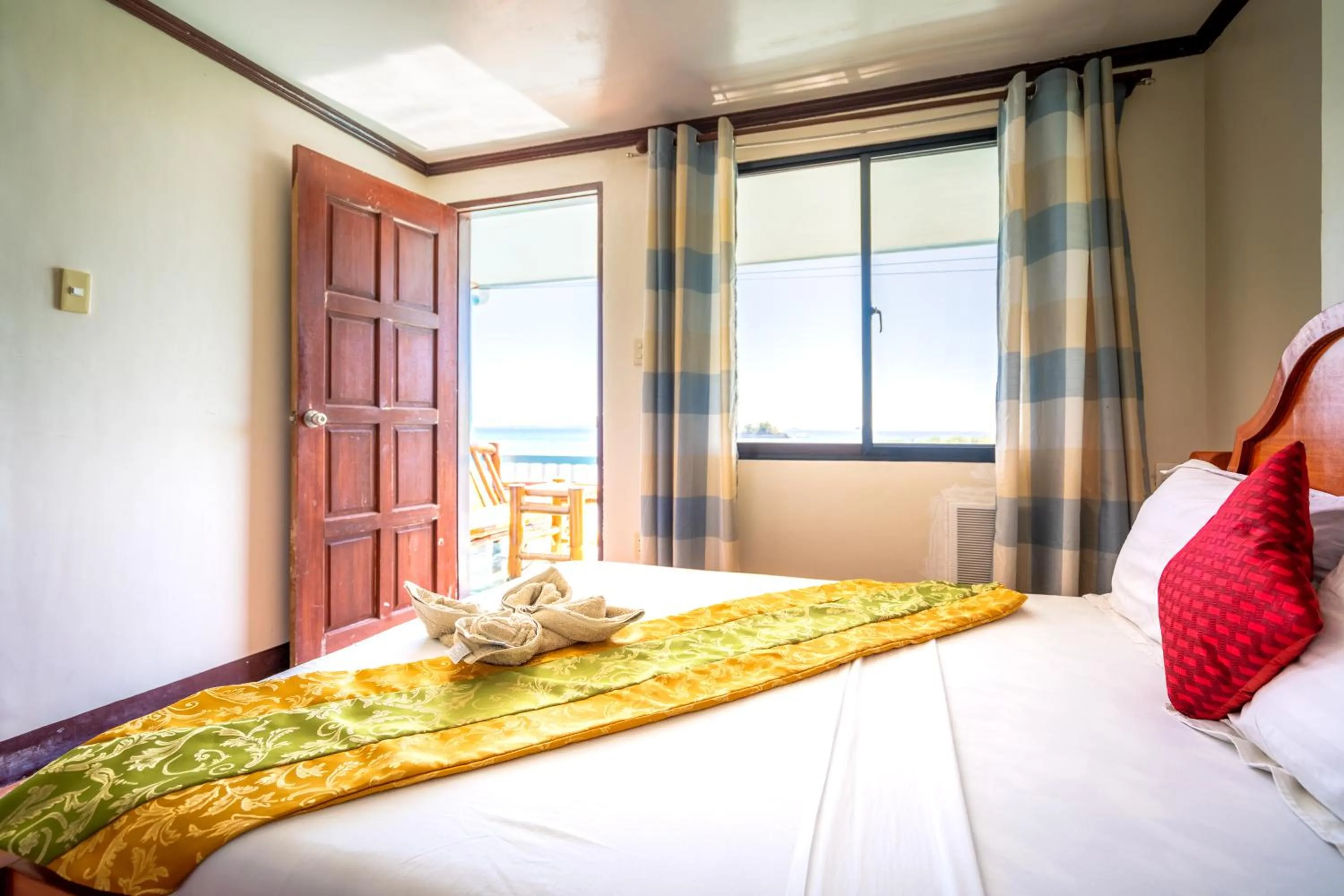 Bed in Blue Corals Beach Resort