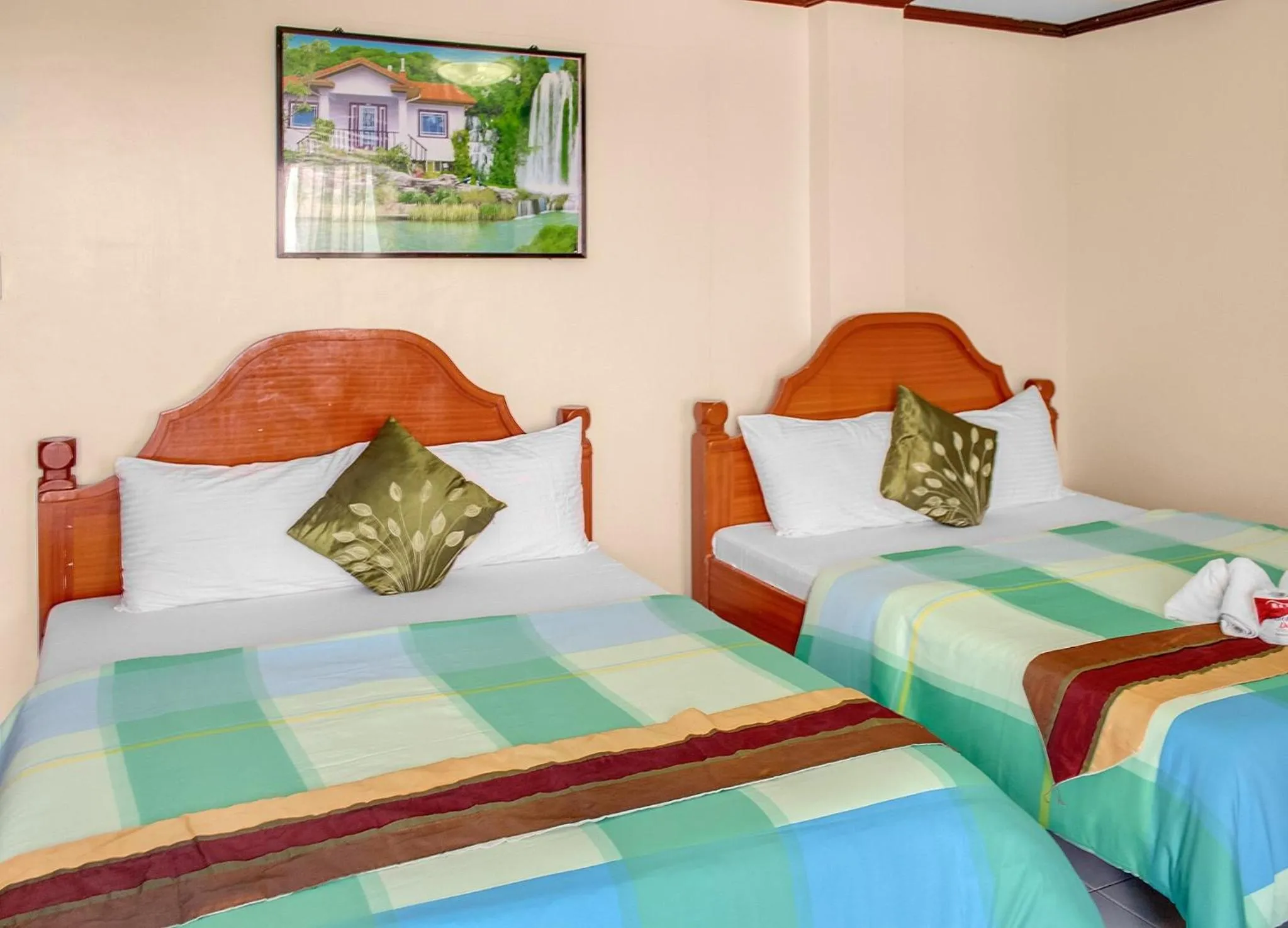 Bed in Blue Corals Beach Resort