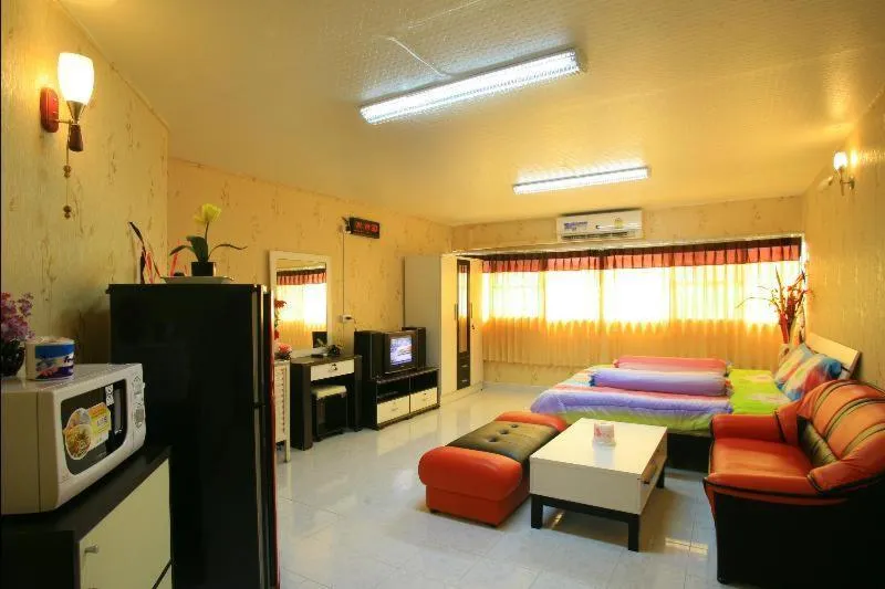 Communal lounge/ TV room, Bed in Deluxe at Popular Condo