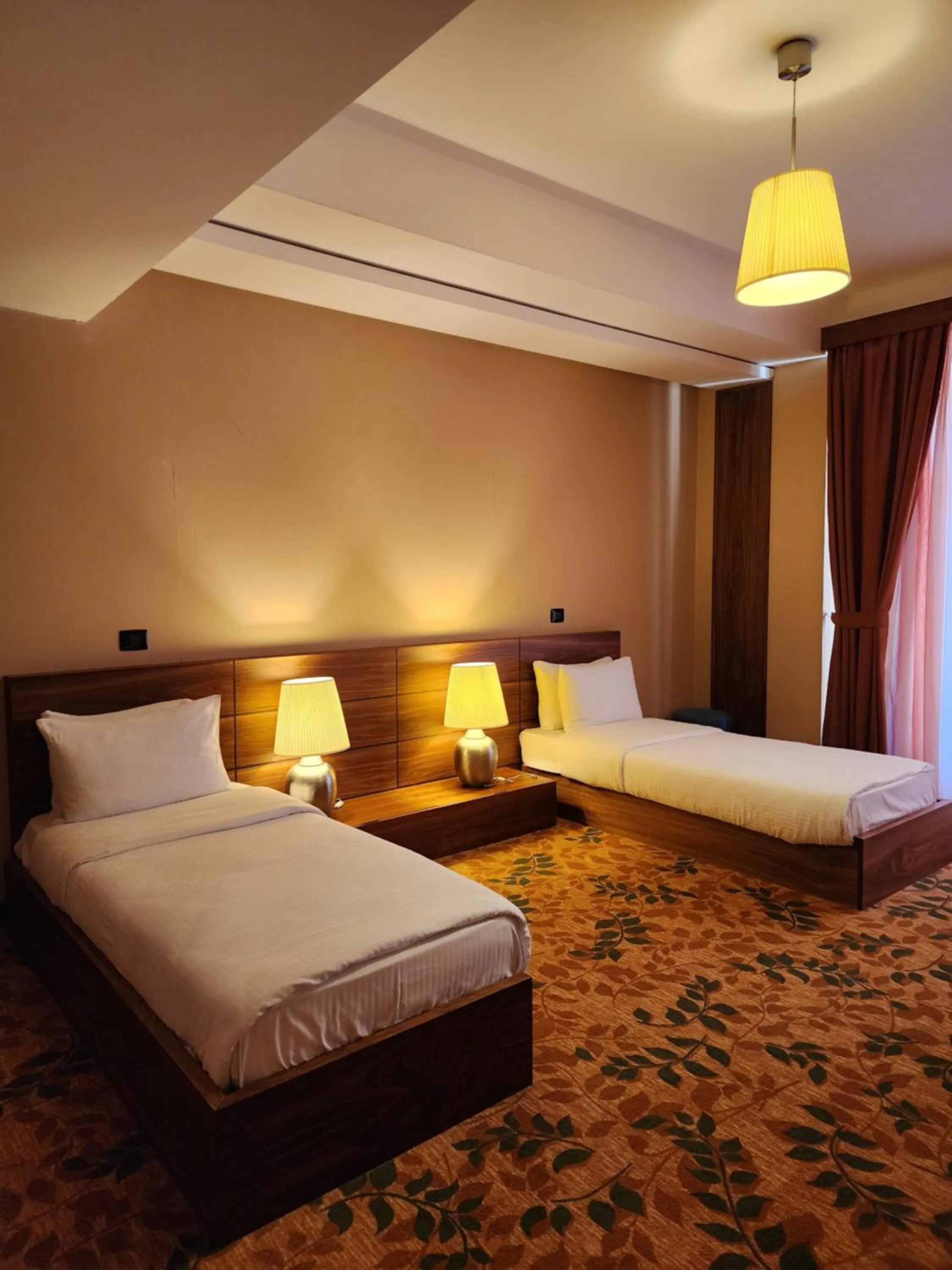 Bed in El Resort Hotel