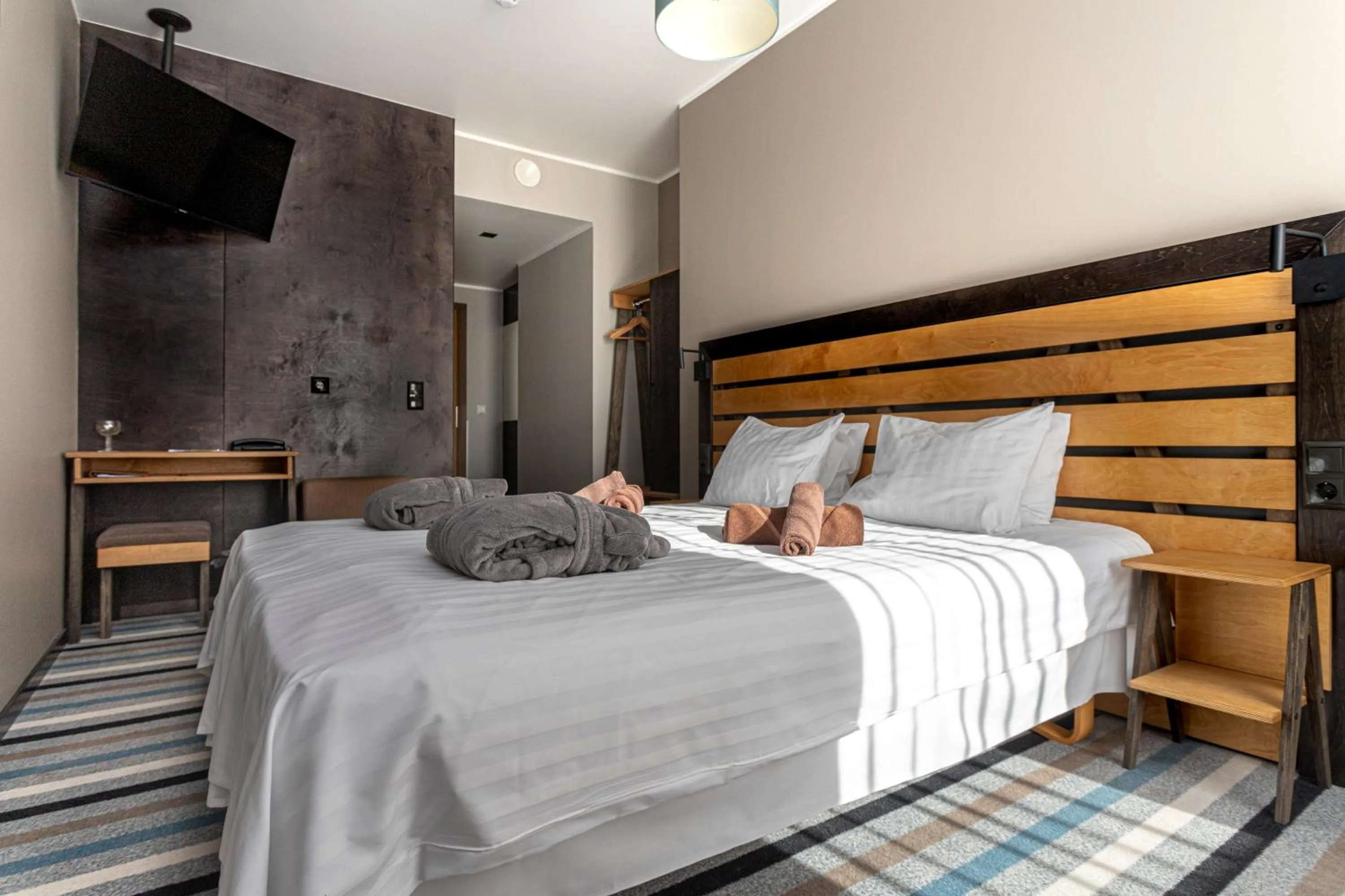 Bed in Johan Design & SPA Hotel