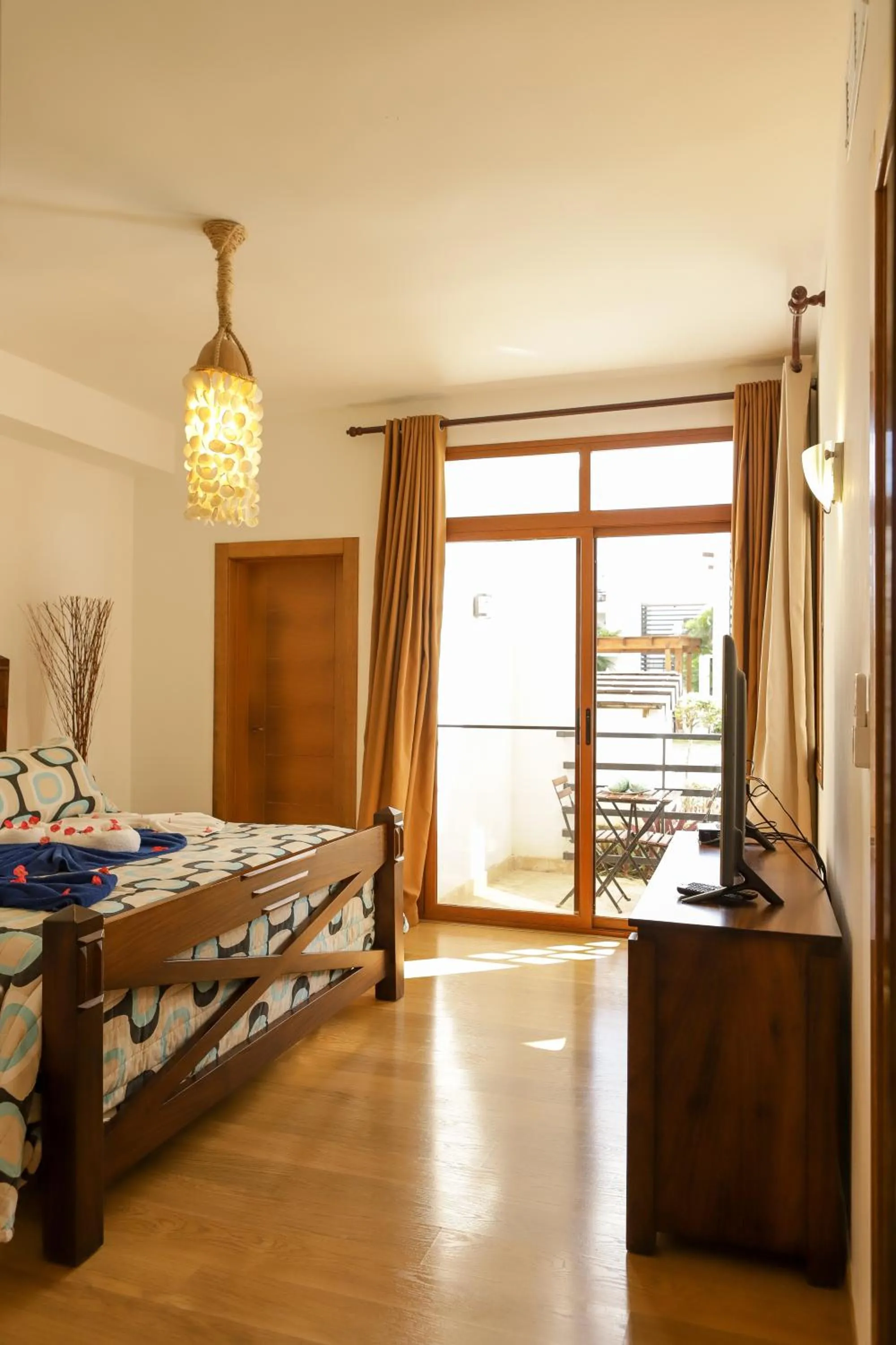 Bed in Sybaris Suites & Residences