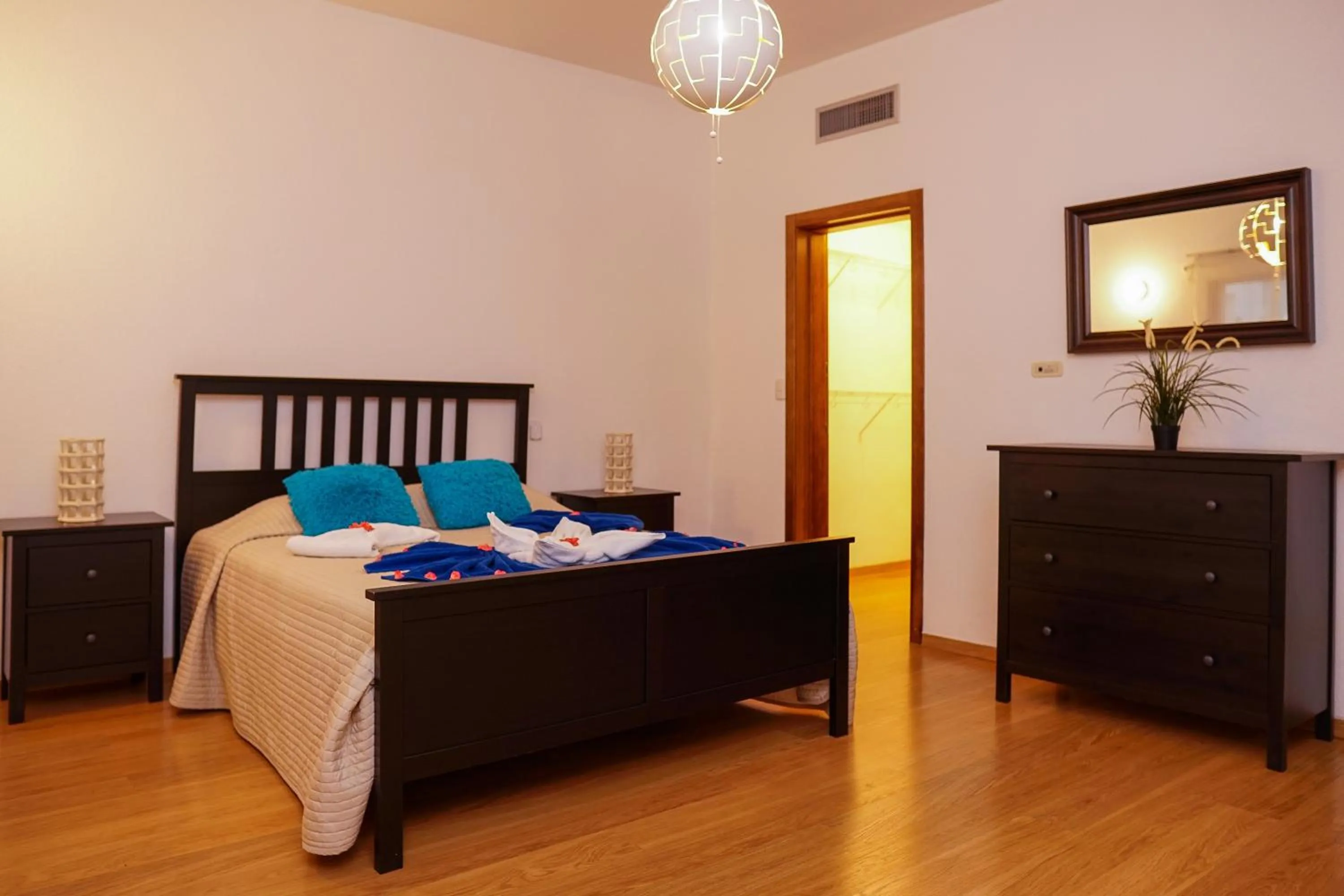 Bed in Sybaris Suites & Residences