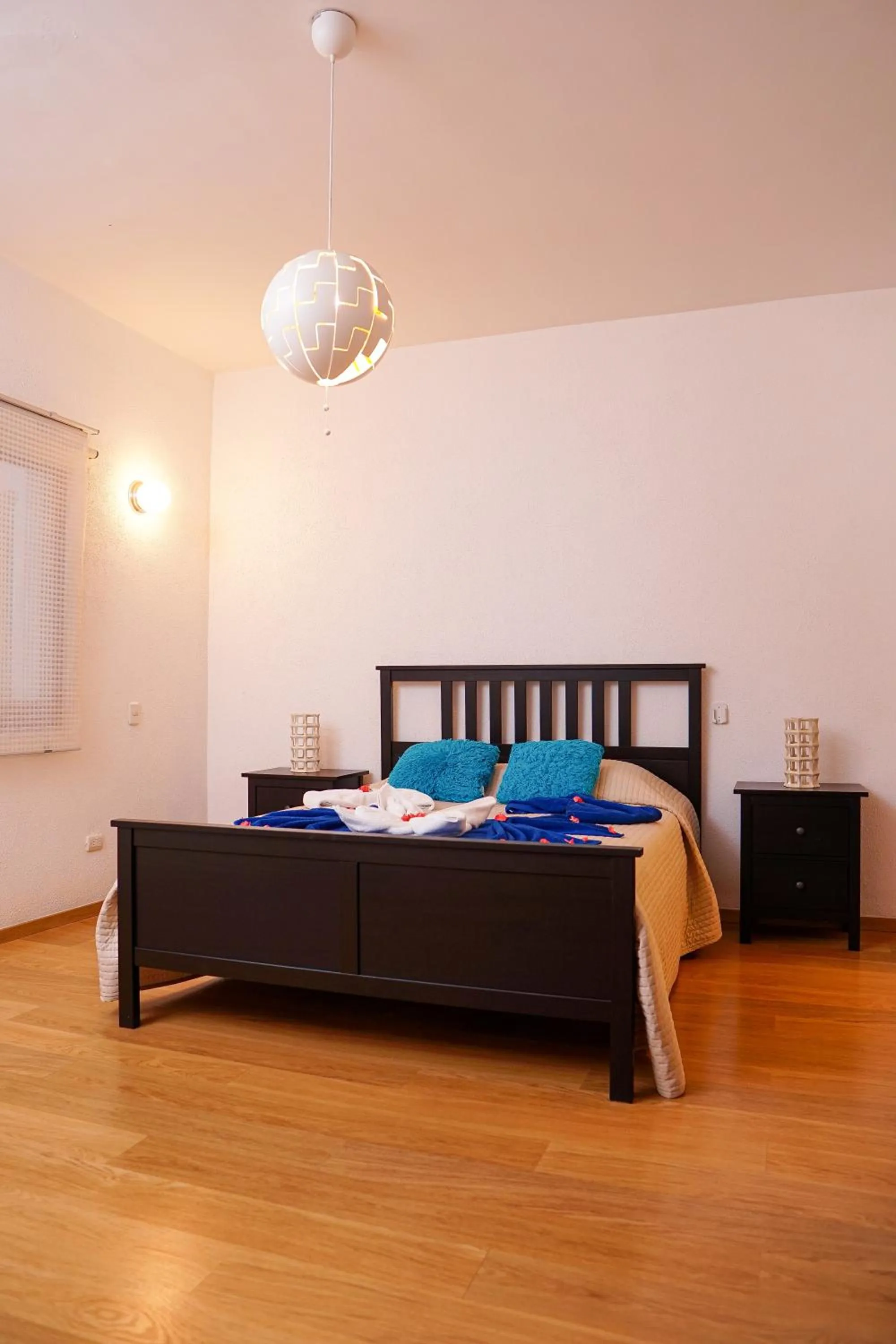 Bed in Sybaris Suites & Residences