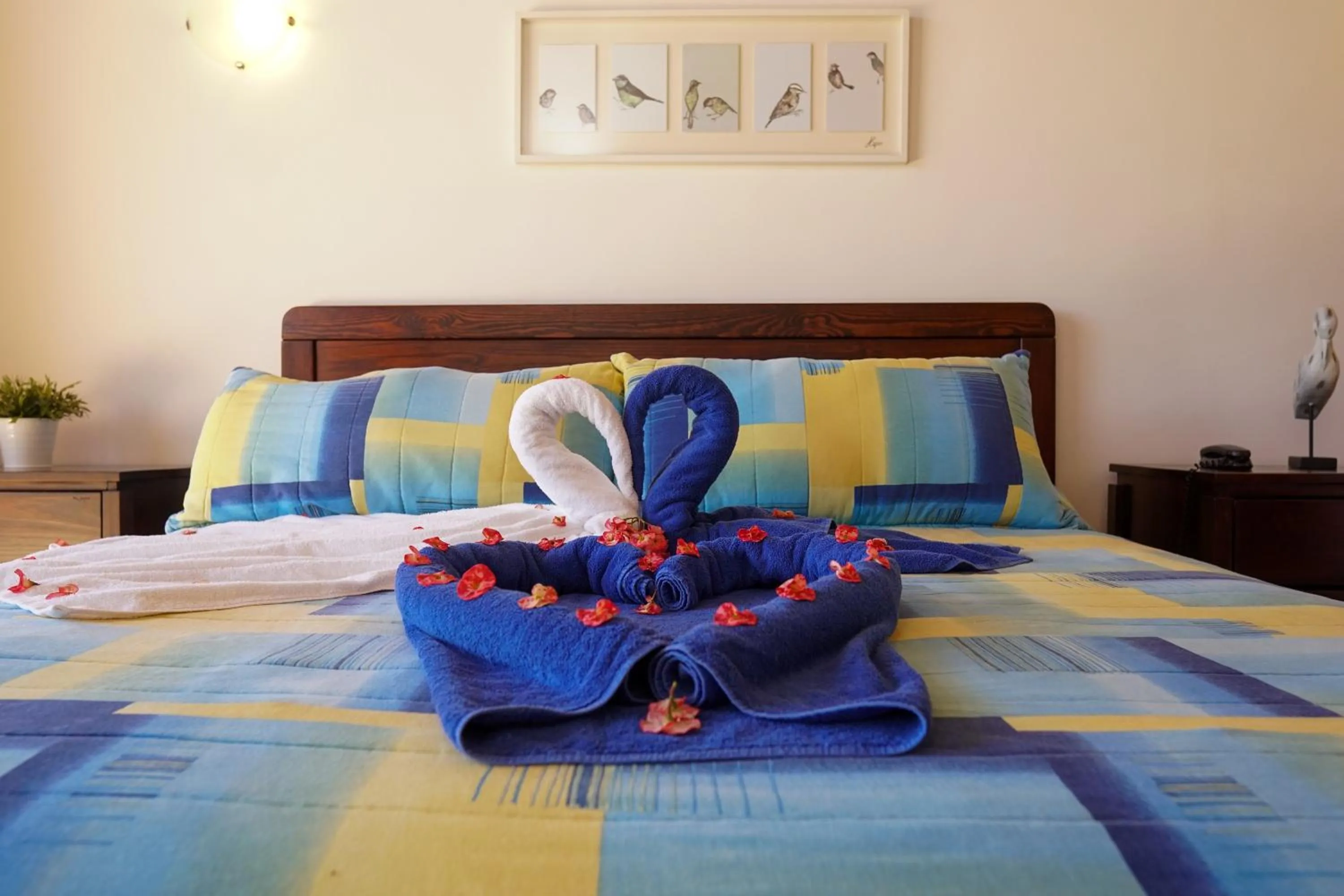 Bed in Sybaris Suites & Residences