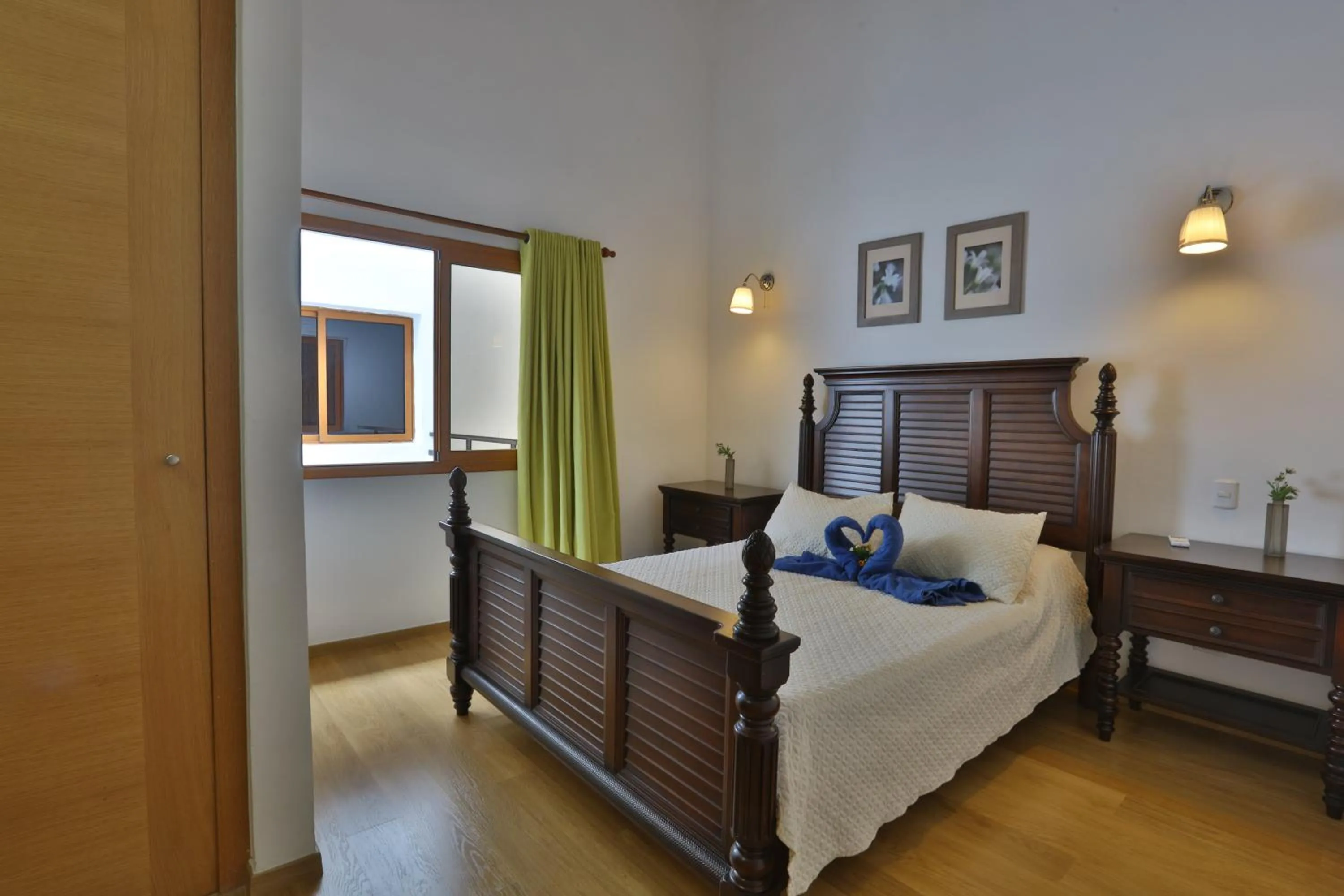 Bed in Sybaris Suites & Residences