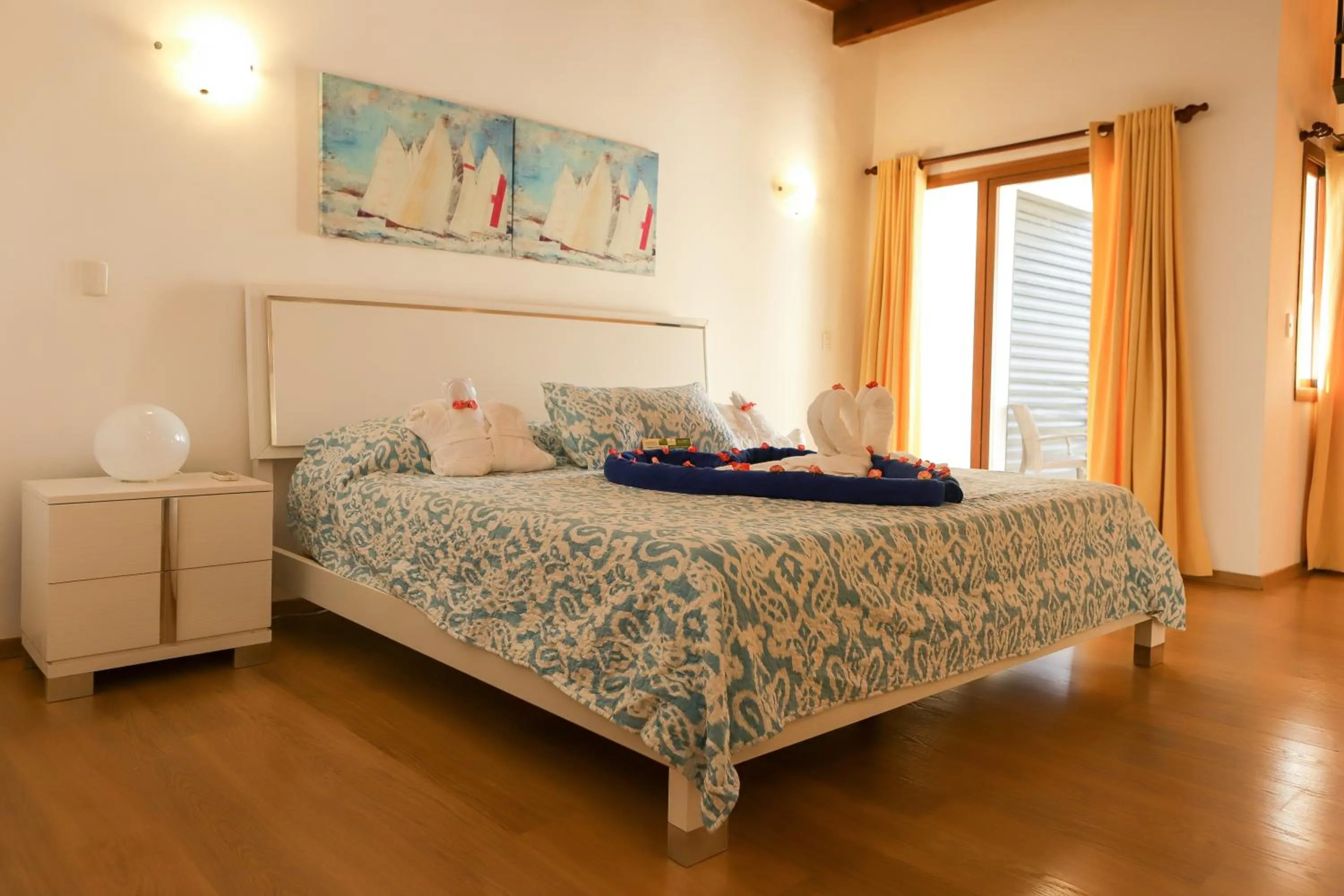Bed in Sybaris Suites & Residences
