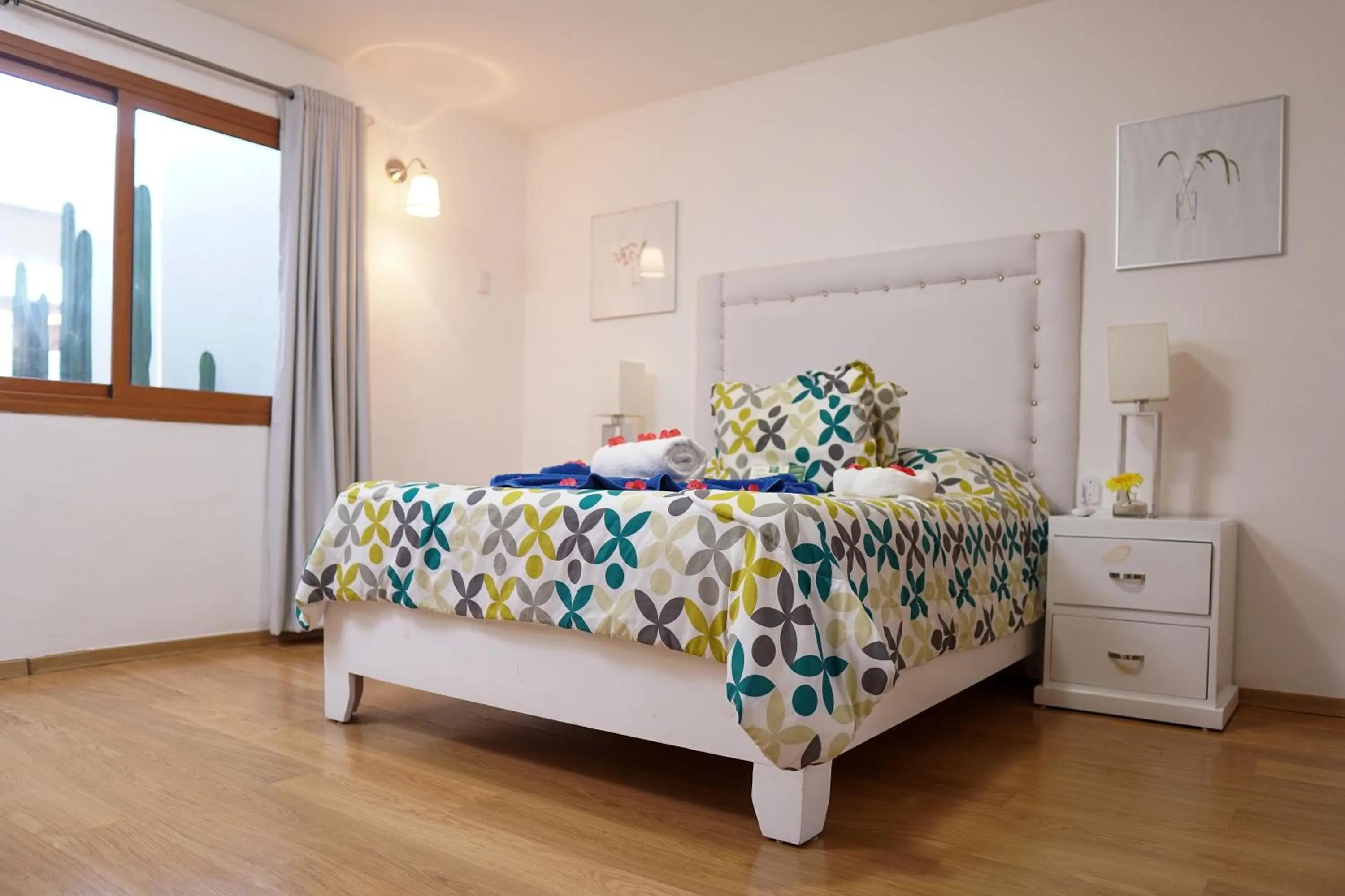 Bed in Sybaris Suites & Residences