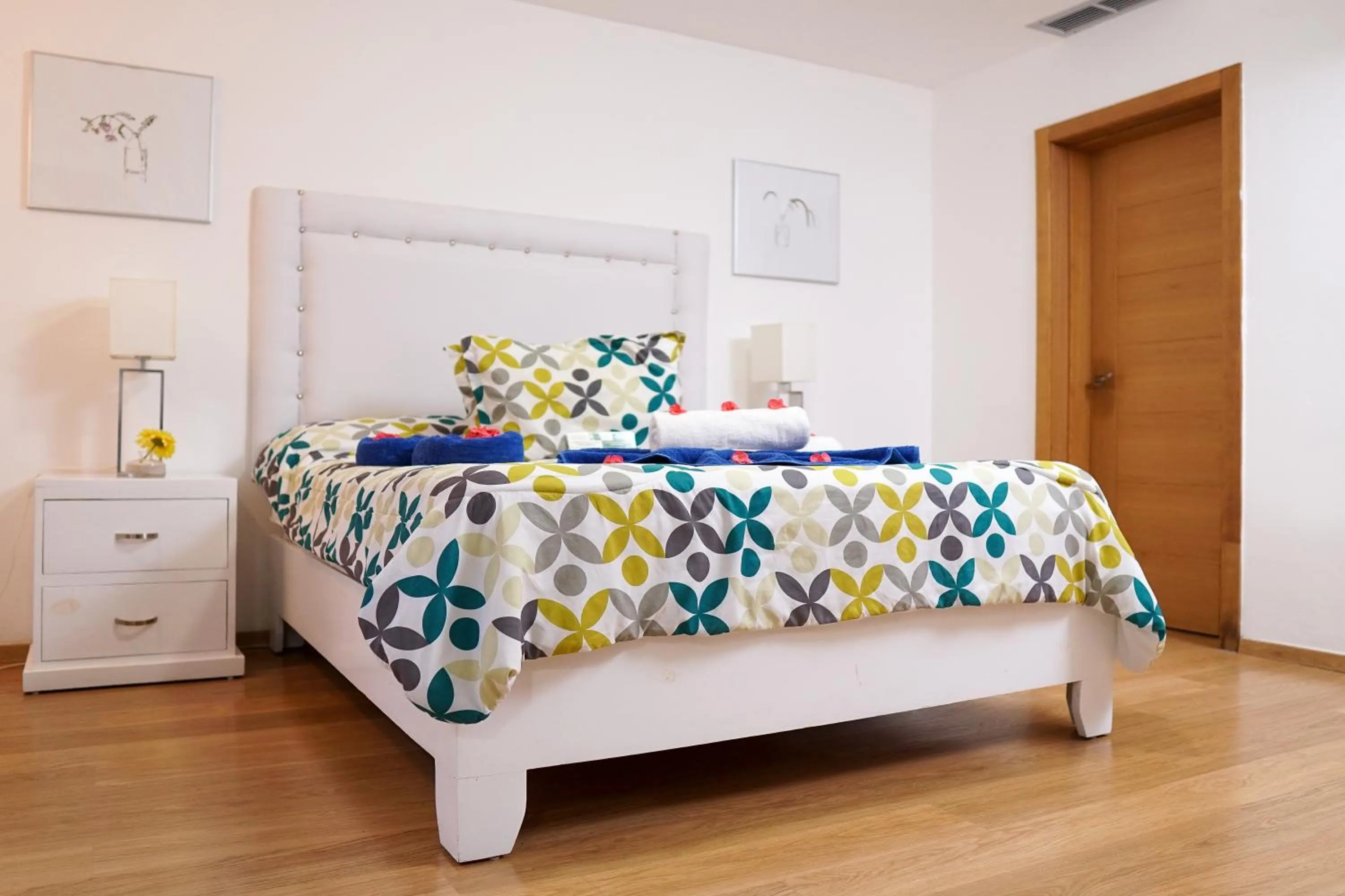 Bed in Sybaris Suites & Residences