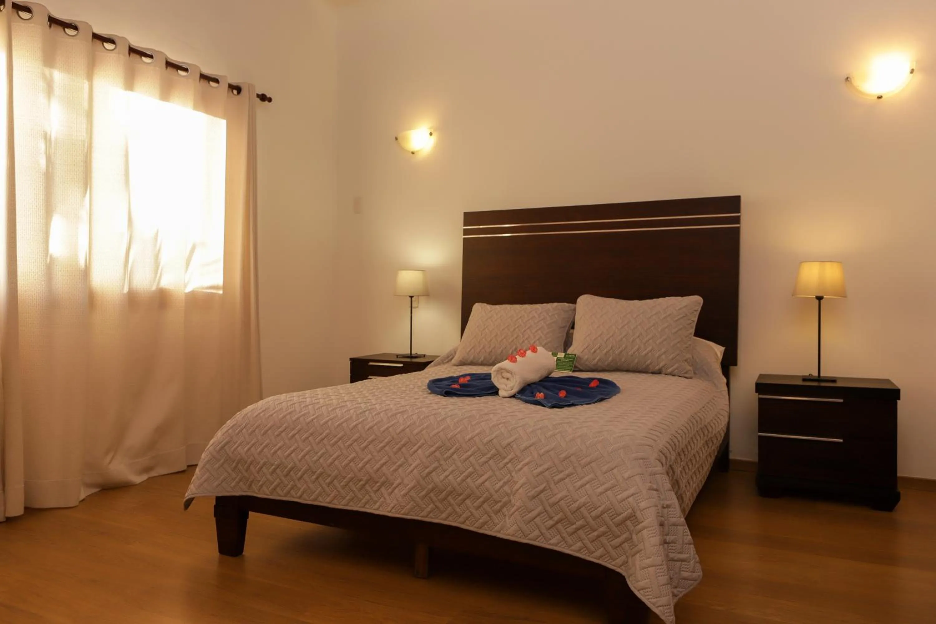Bed in Sybaris Suites & Residences