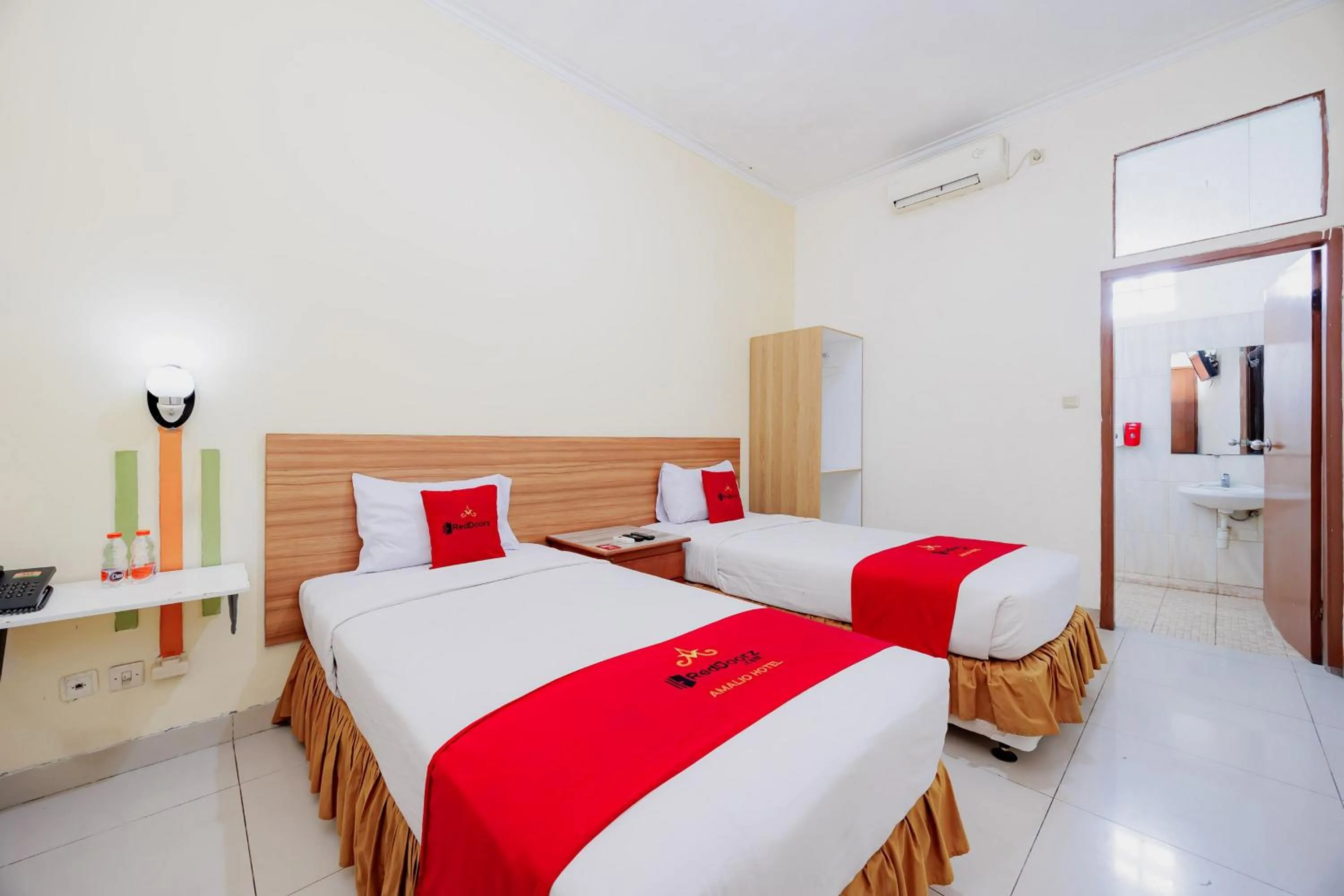Bedroom, Bed in RedDoorz Plus at Amalio Hotel Surapati