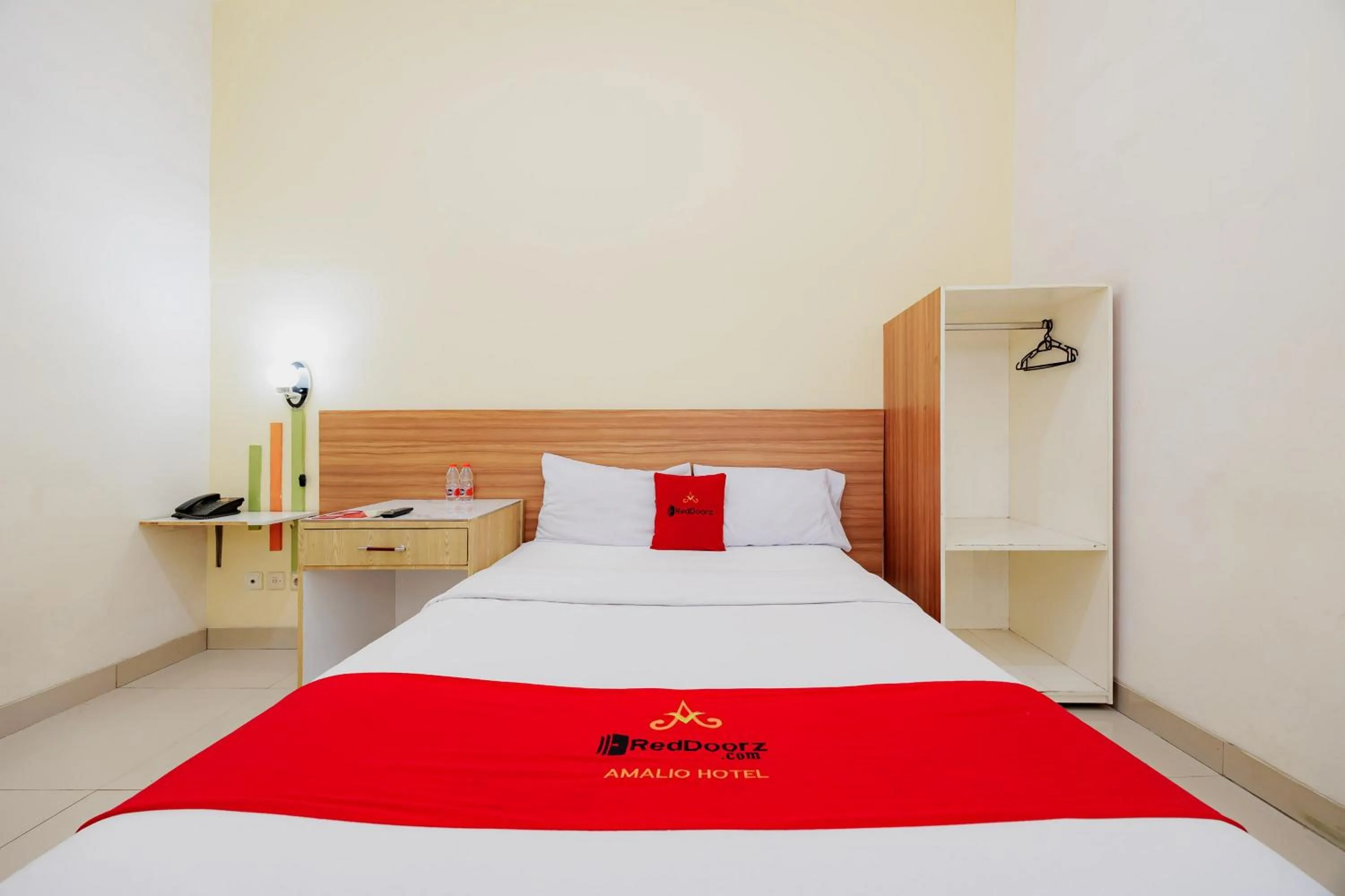 Bedroom, Bed in RedDoorz Plus at Amalio Hotel Surapati