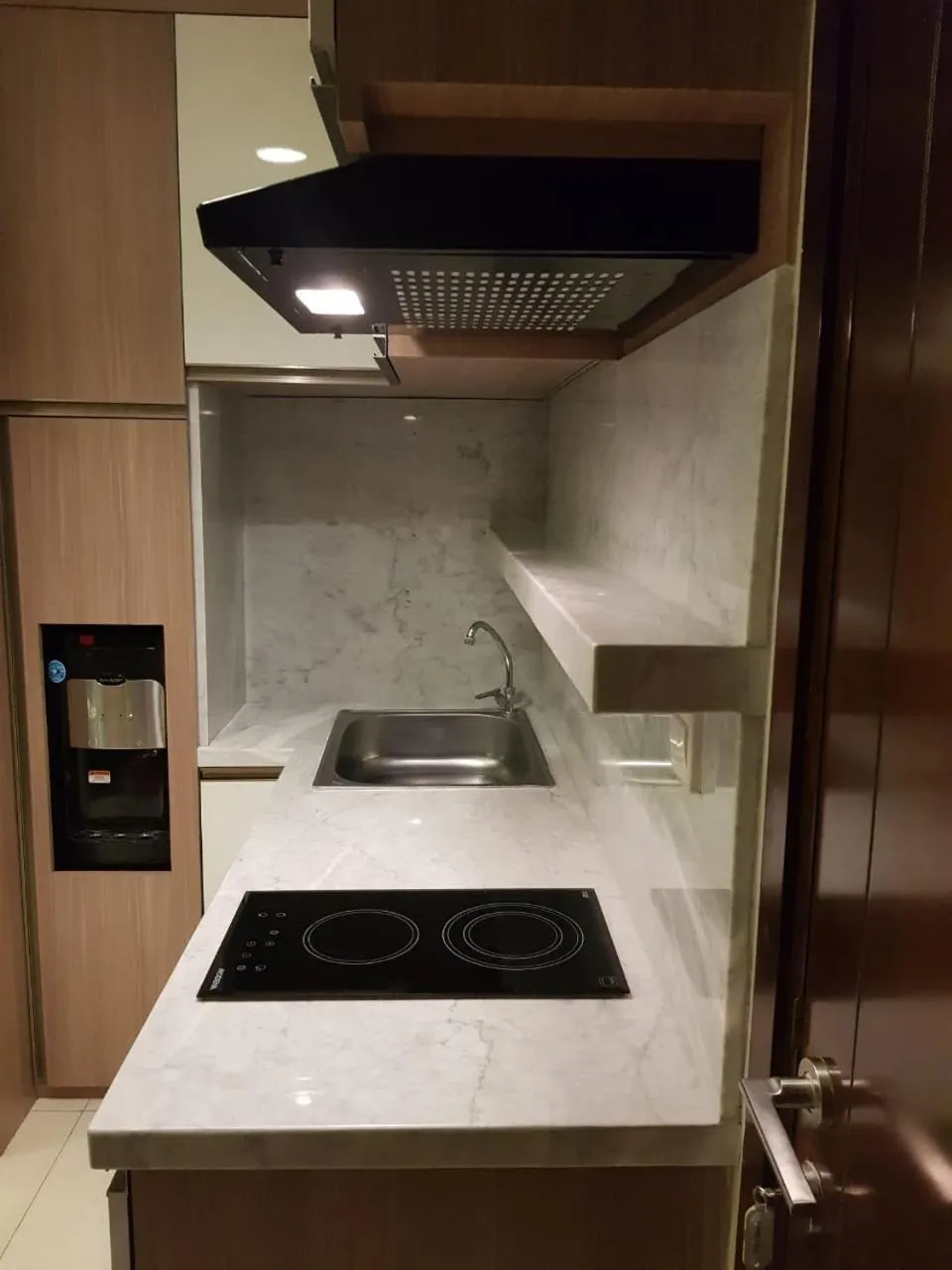 Kitchen or kitchenette in M-Town Signature Gading Serpong by J`s Luxury Apartment