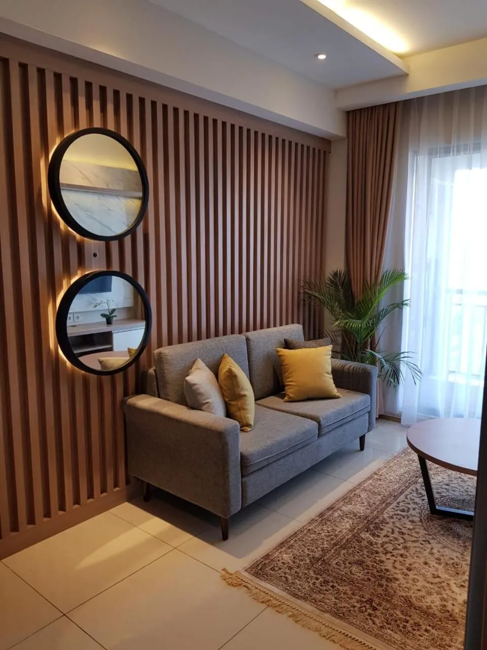 Living room in M-Town Signature Gading Serpong by J`s Luxury Apartment