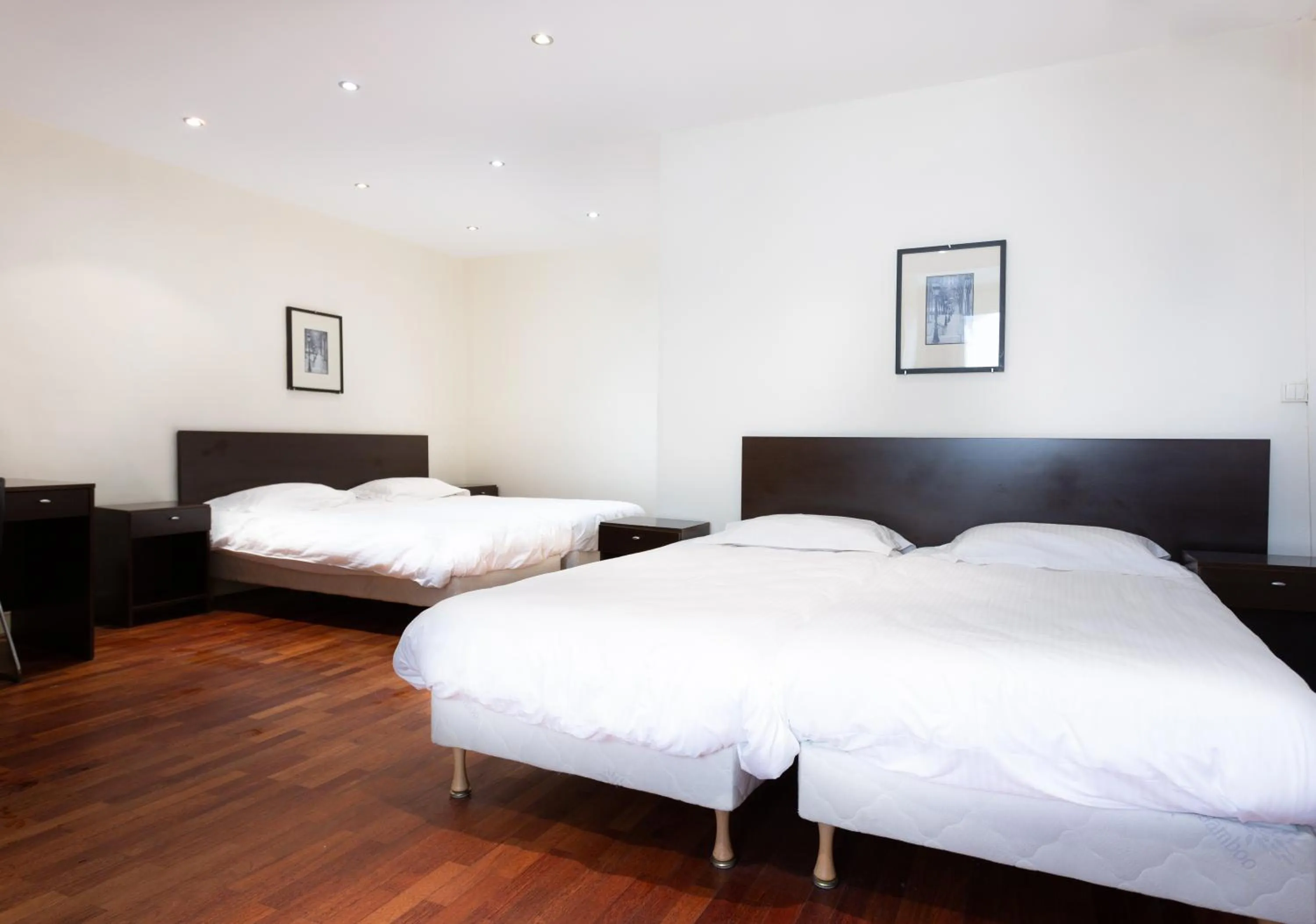 Bed in Hotel Mimosa Paris