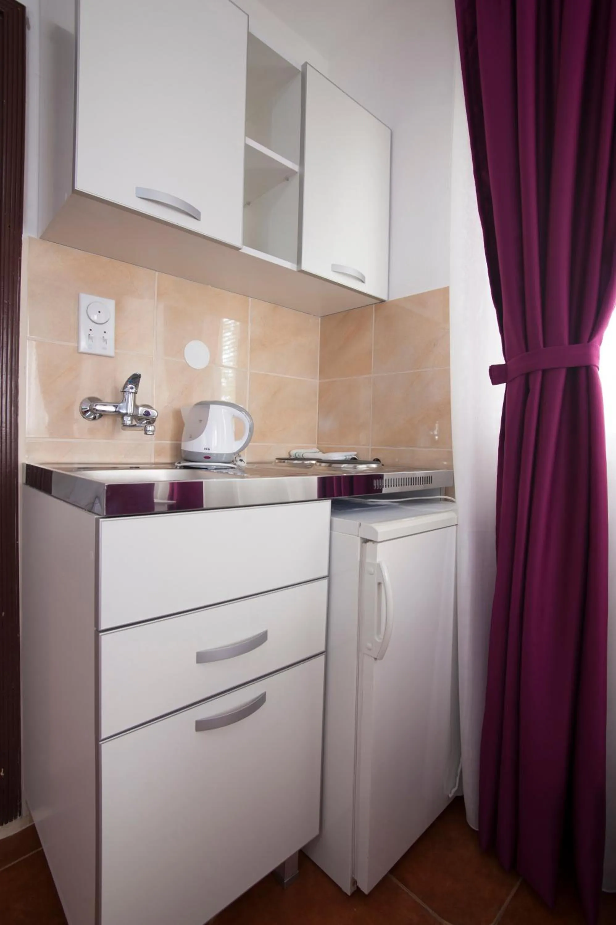 Kitchen or kitchenette in Apartments Grand