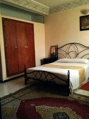 Photo of the whole room, Bed in Hôtel Tijani