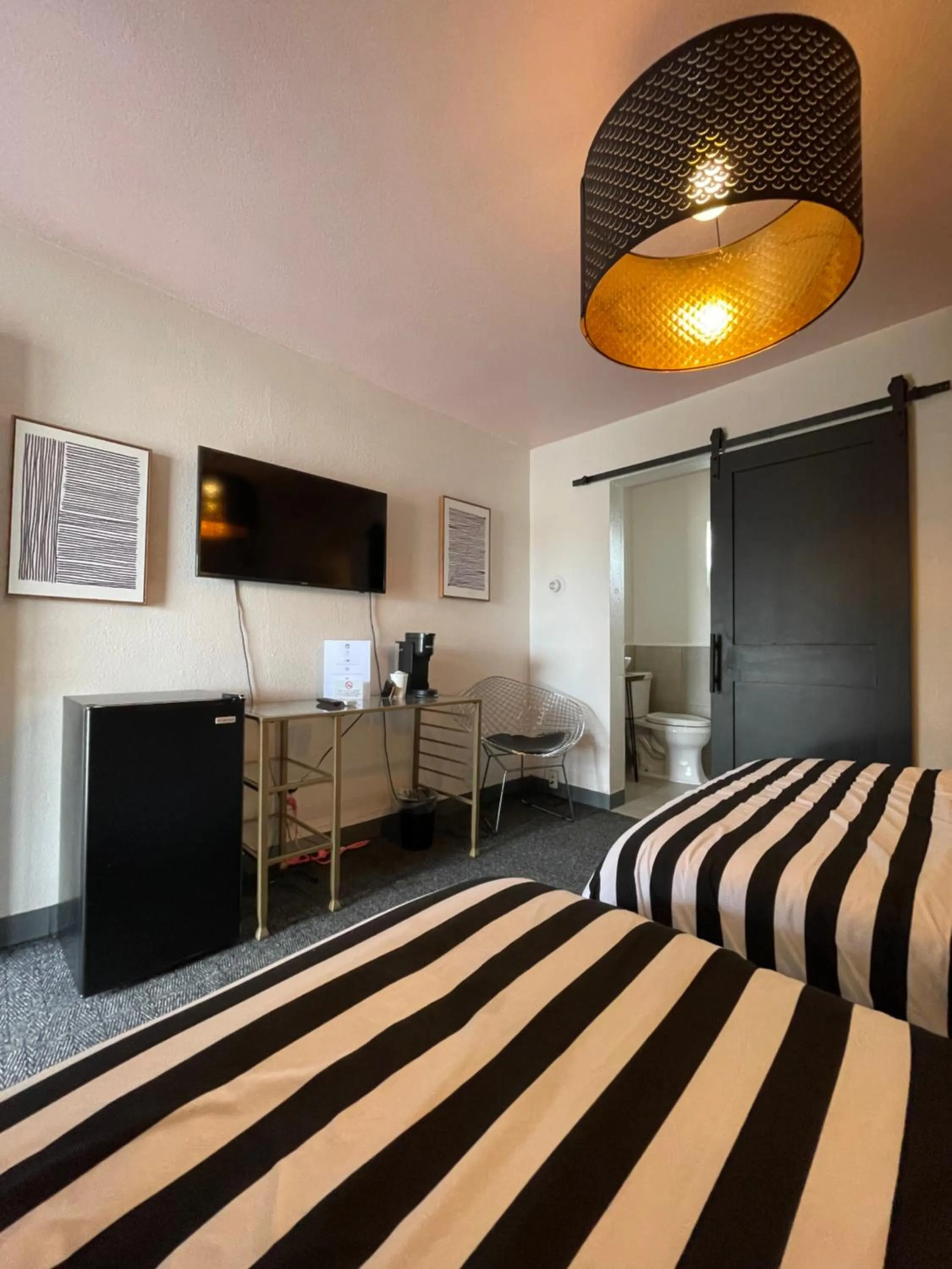 Bed in Rainbow Motel