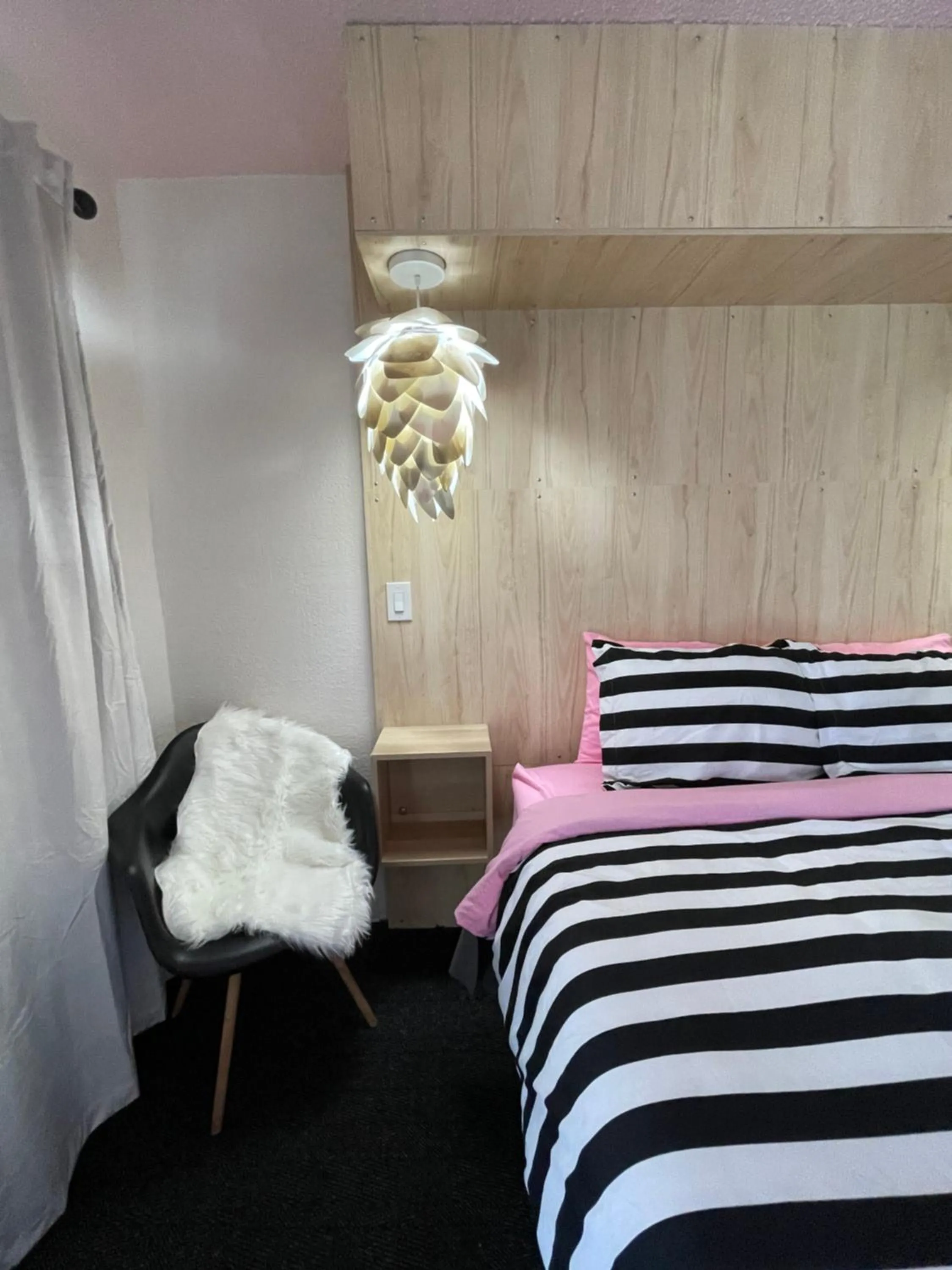 Bed in Rainbow Motel